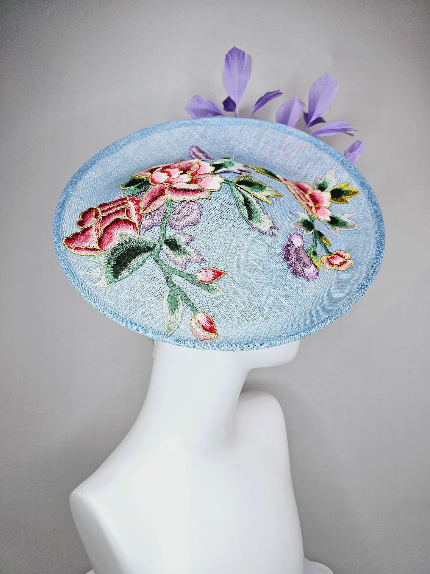 kentucky derby hat fascinator light blue sinamay saucer with embroidered gold pink lavender purple flowers and pink and purple feathers