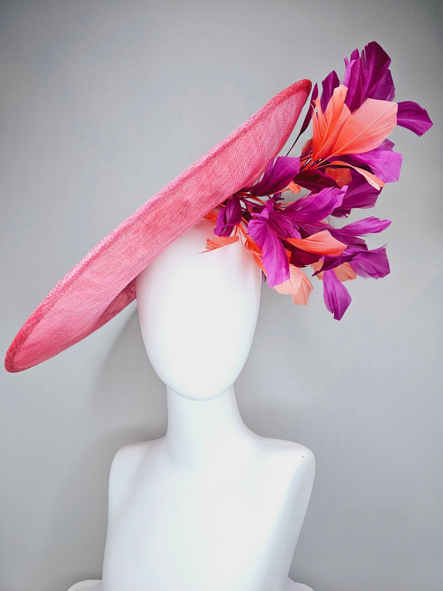 kentucky derby hat fascinator bright pink coral sinamay saucer with lavender purple coral yellow embroidered flowers purple coral feathers