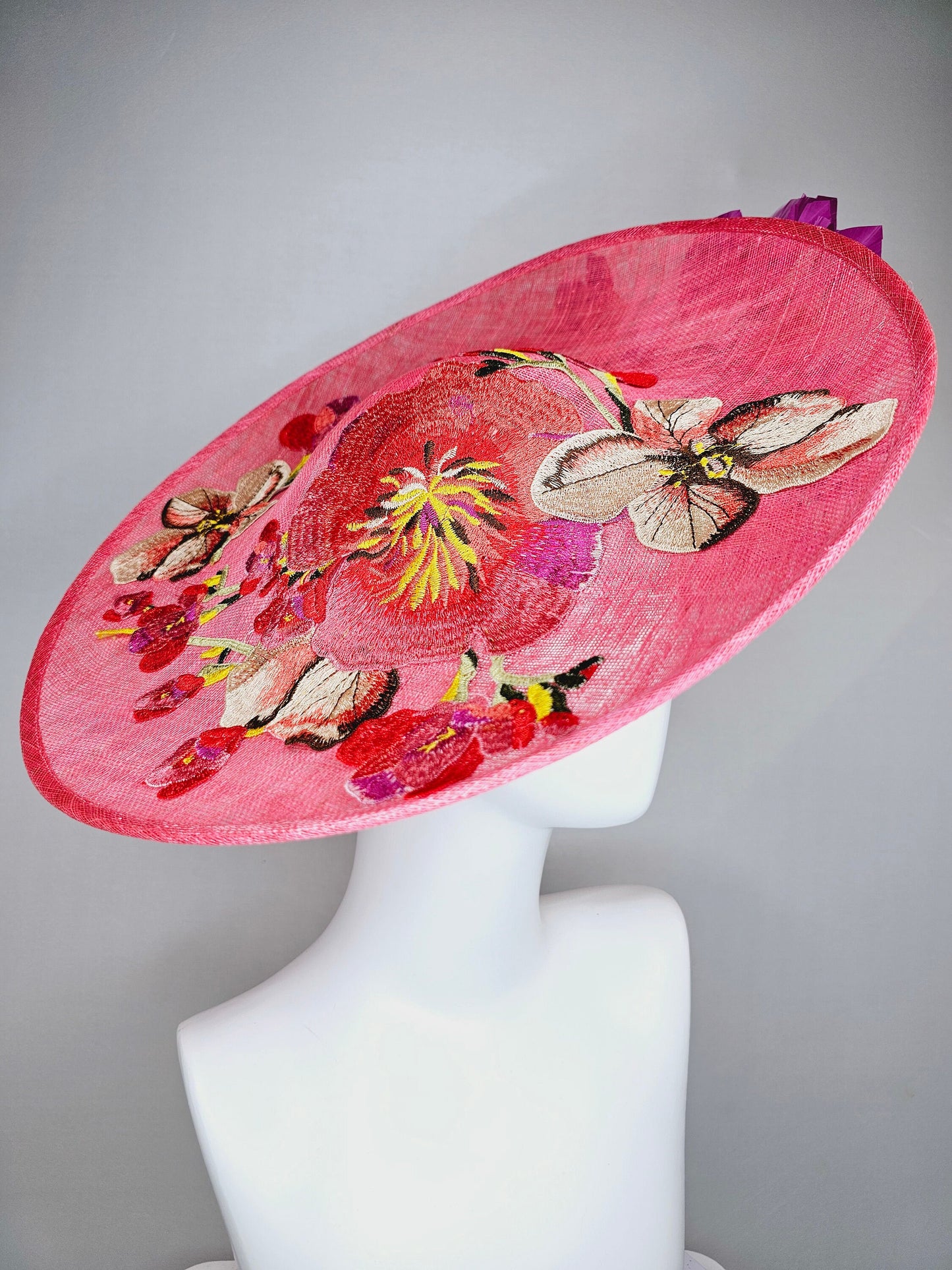 kentucky derby hat fascinator bright pink coral sinamay saucer with lavender purple coral yellow embroidered flowers purple coral feathers