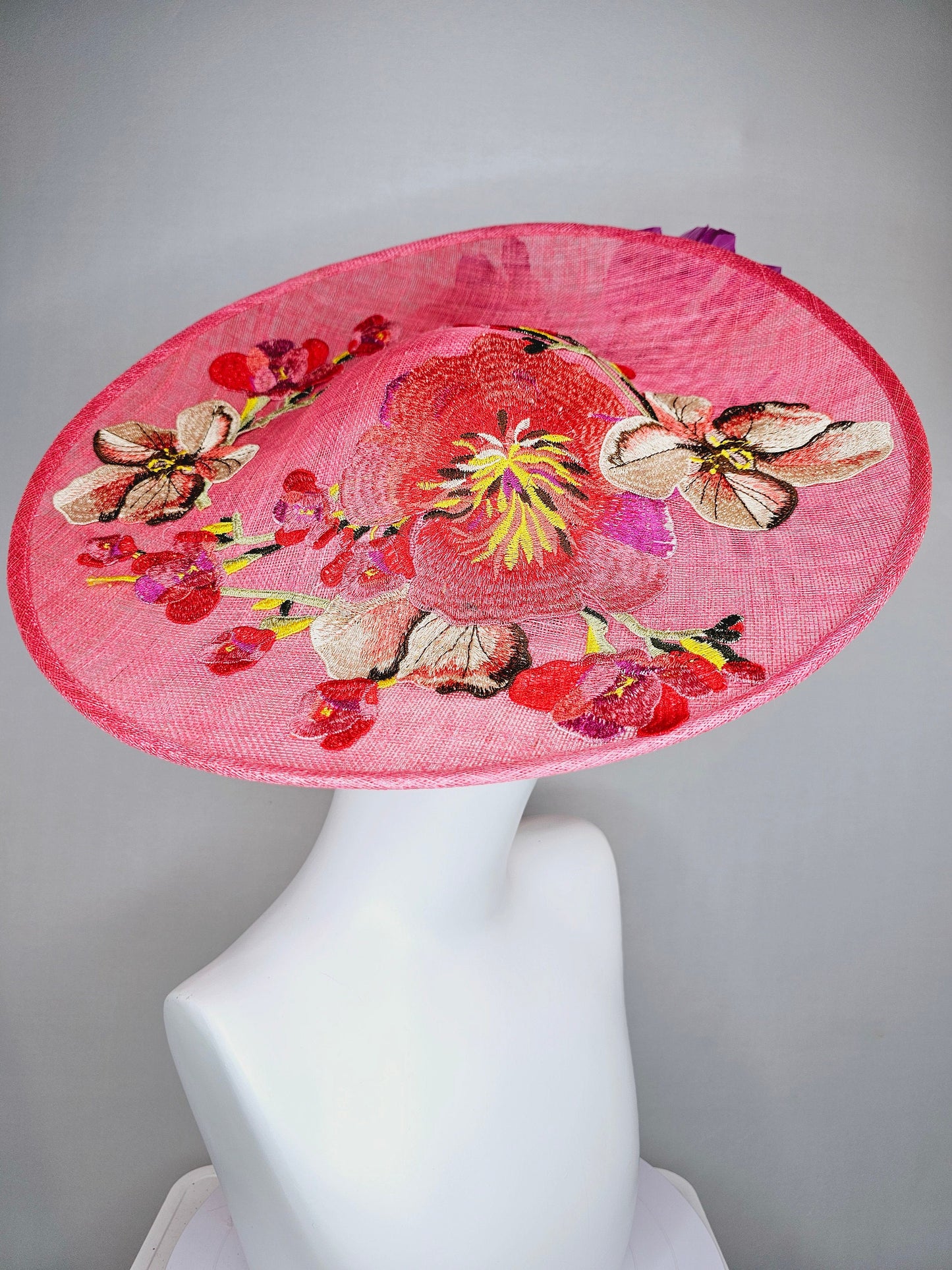 kentucky derby hat fascinator bright pink coral sinamay saucer with lavender purple coral yellow embroidered flowers purple coral feathers