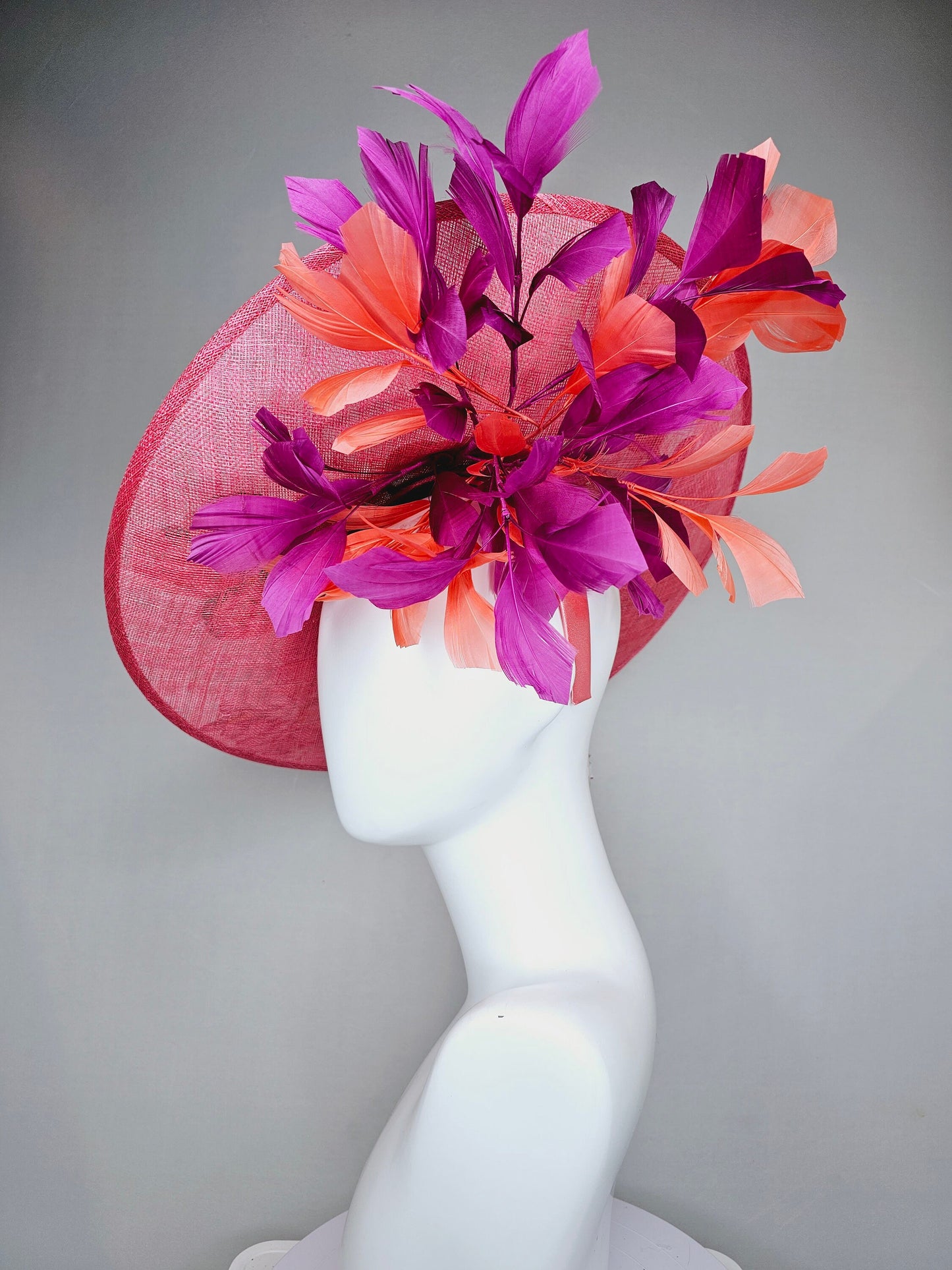 kentucky derby hat fascinator bright pink coral sinamay saucer with lavender purple coral yellow embroidered flowers purple coral feathers