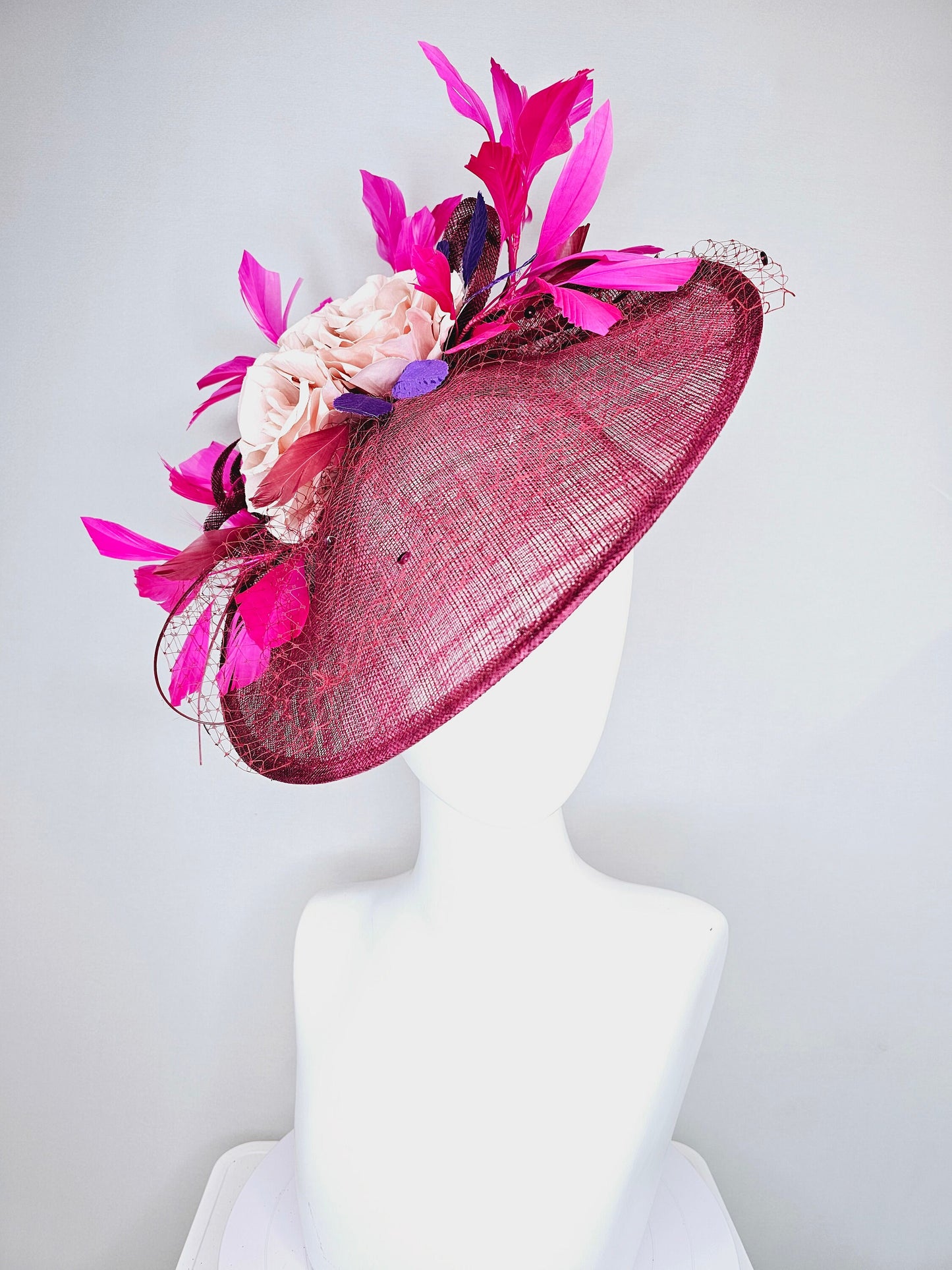 kentucky derby hat fascinator magenta maroon wine saucer with netting mauve pink flowers purple leaves and fuchsia pink feathers