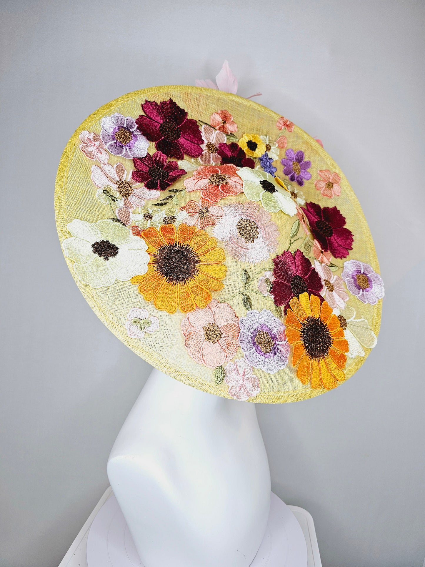 kentucky derby hat fascinator large yellow saucer sinamay rainbow red orange green pink embroidered flowers pink coral branching feathers