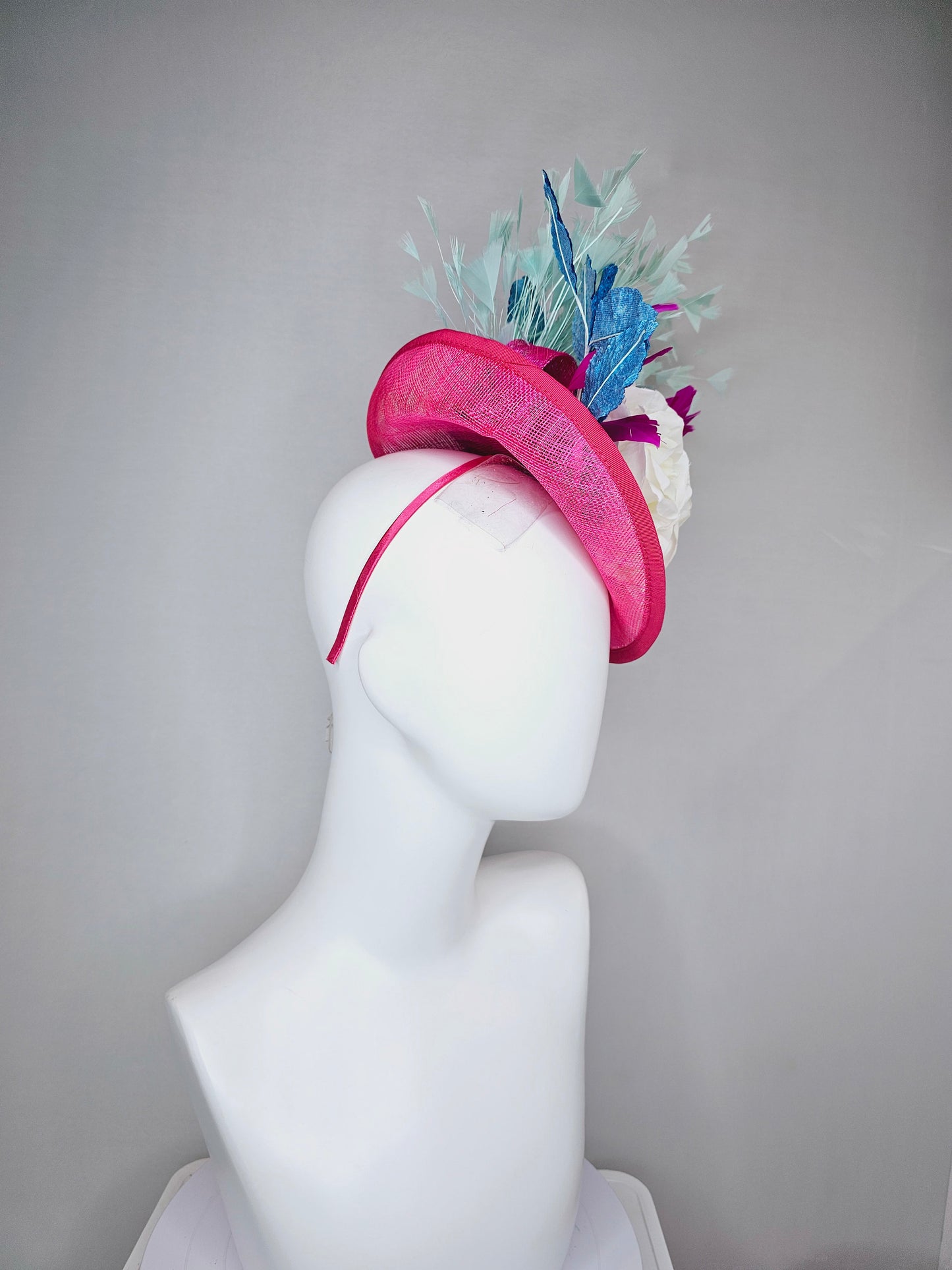 kentucky derby hat fascinator pink sinamay saucer with white roses turquoise blue leaves and mint green feathers