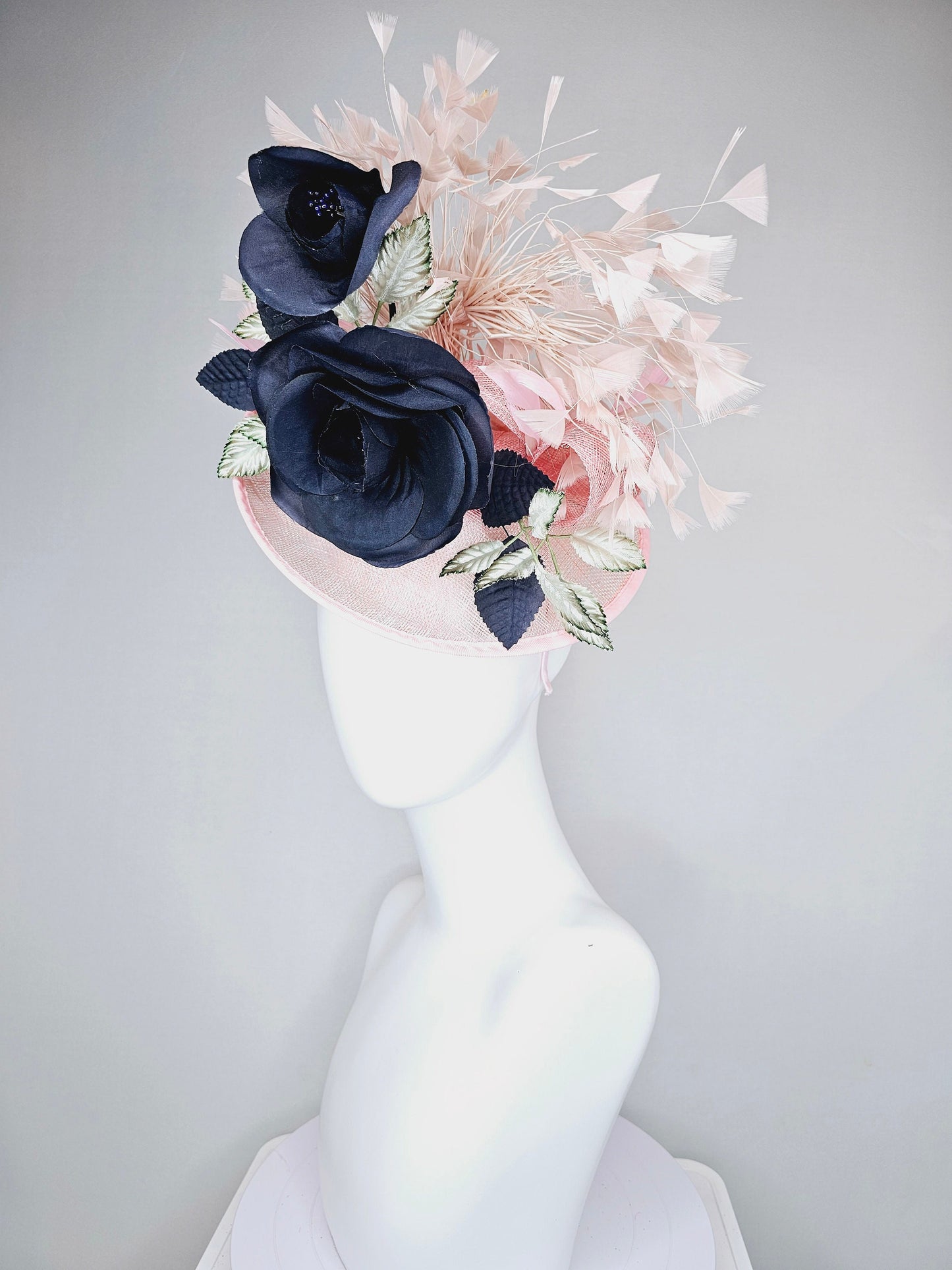 kentucky derby hat fascinator light pink sinamay saucer with black silk flowers silver green ivory leaves and pink feathers