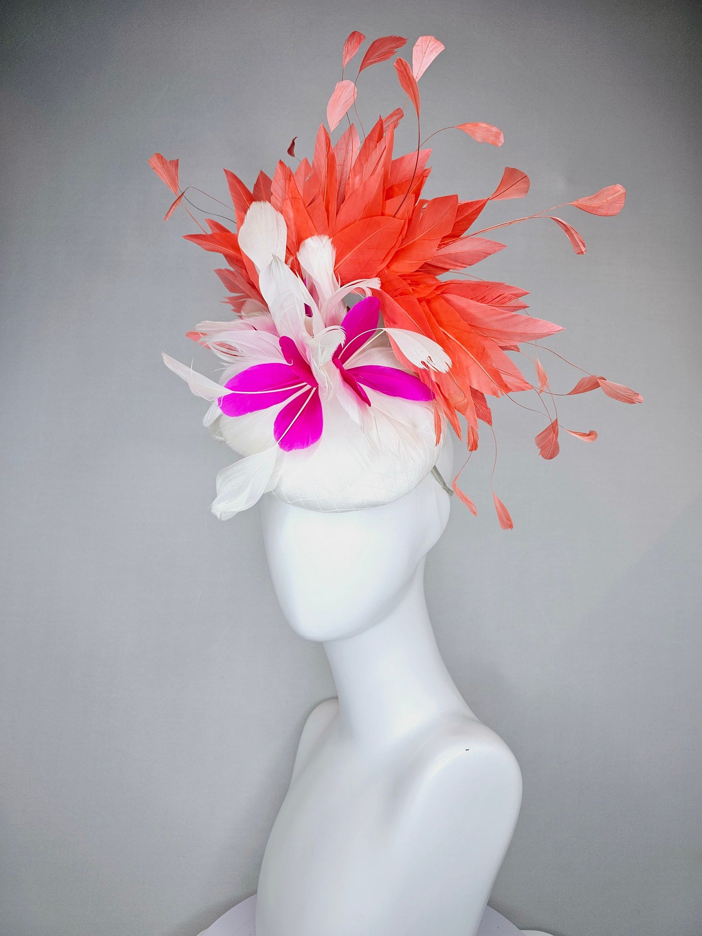 kentucky derby hat fascinator white satin with orange coral feathers with white and fuchsia pink feather flower