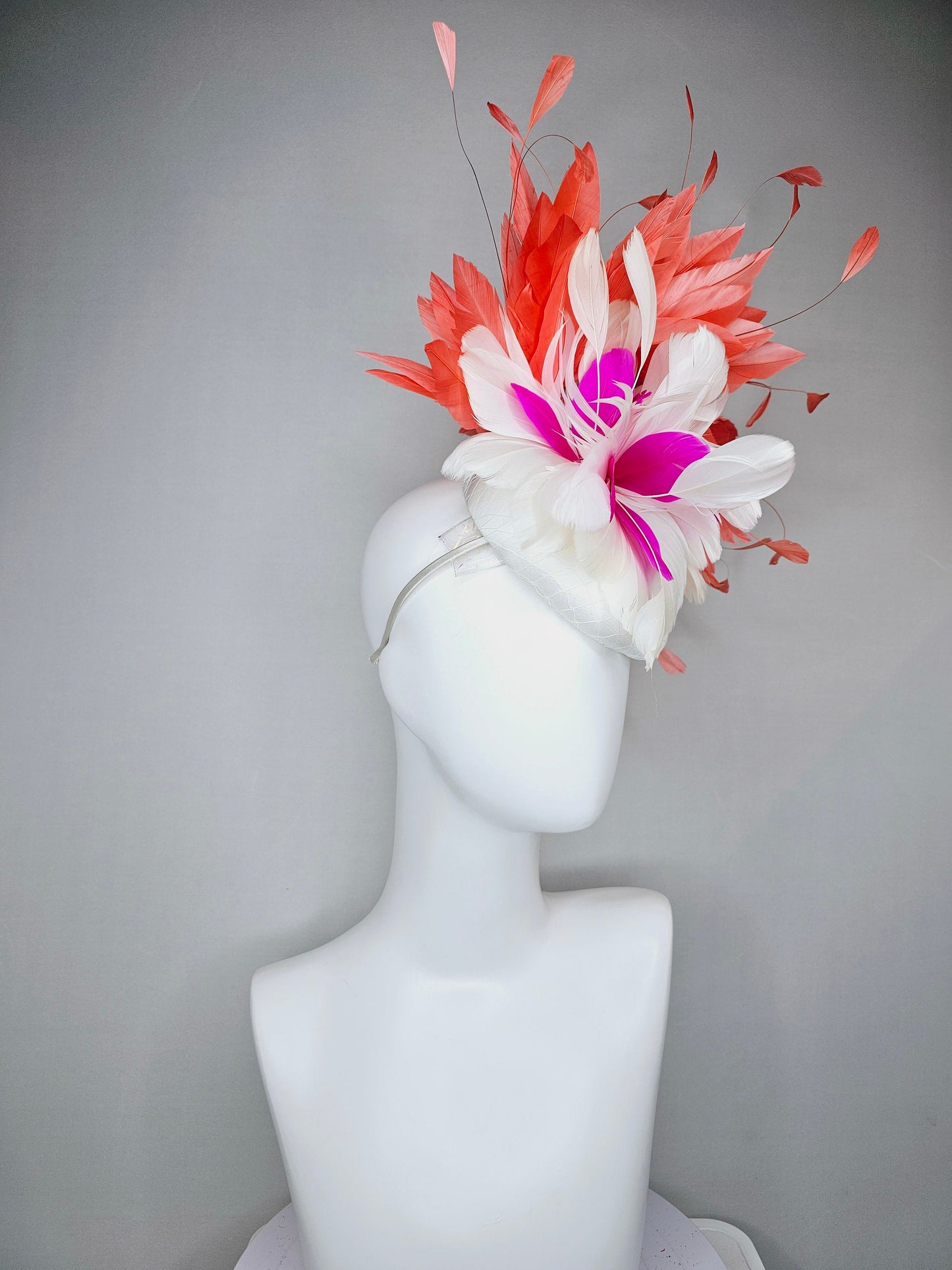kentucky derby hat fascinator white satin with orange coral feathers with white and fuchsia pink feather flower