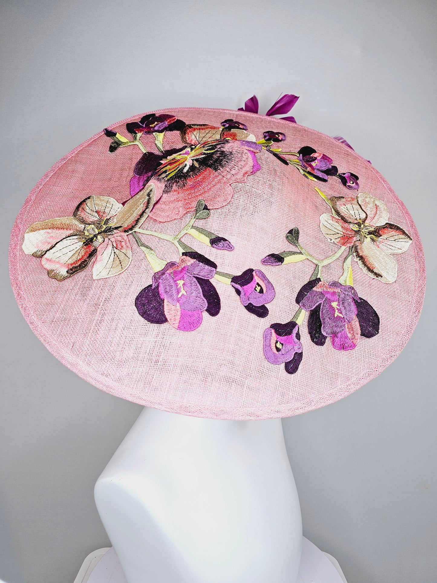 kentucky derby hat fascinator light pink coral sinamay saucer with lavender purple coral yellow embroidered flowers purple coral feathers