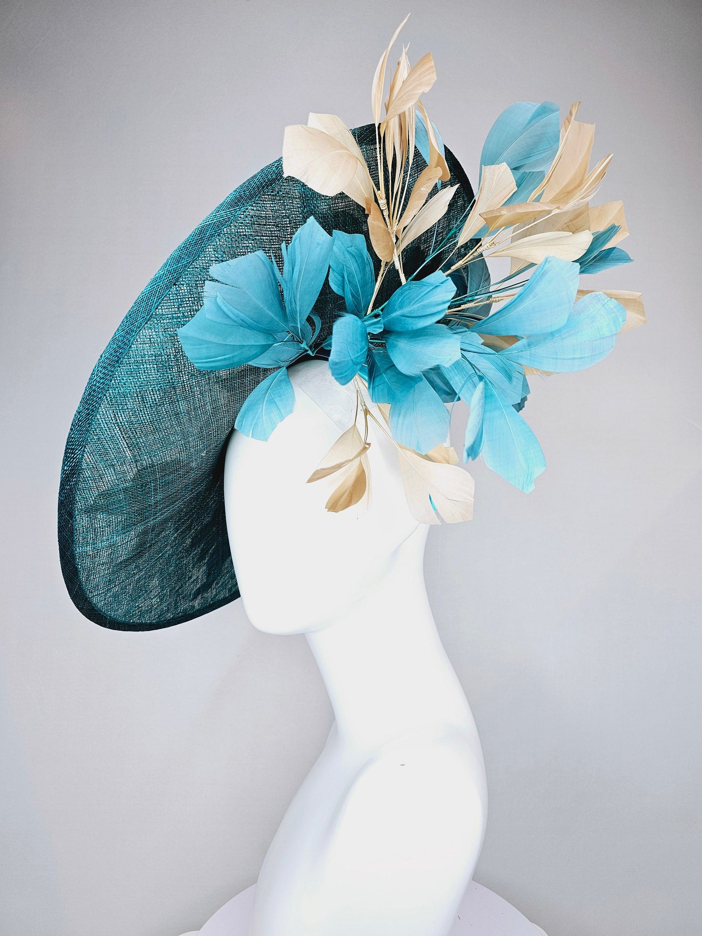 kentucky derby hat fascinator teal blue sinamay saucer with gold and teal peacock blue green feathers and teal gold embroidered flowers