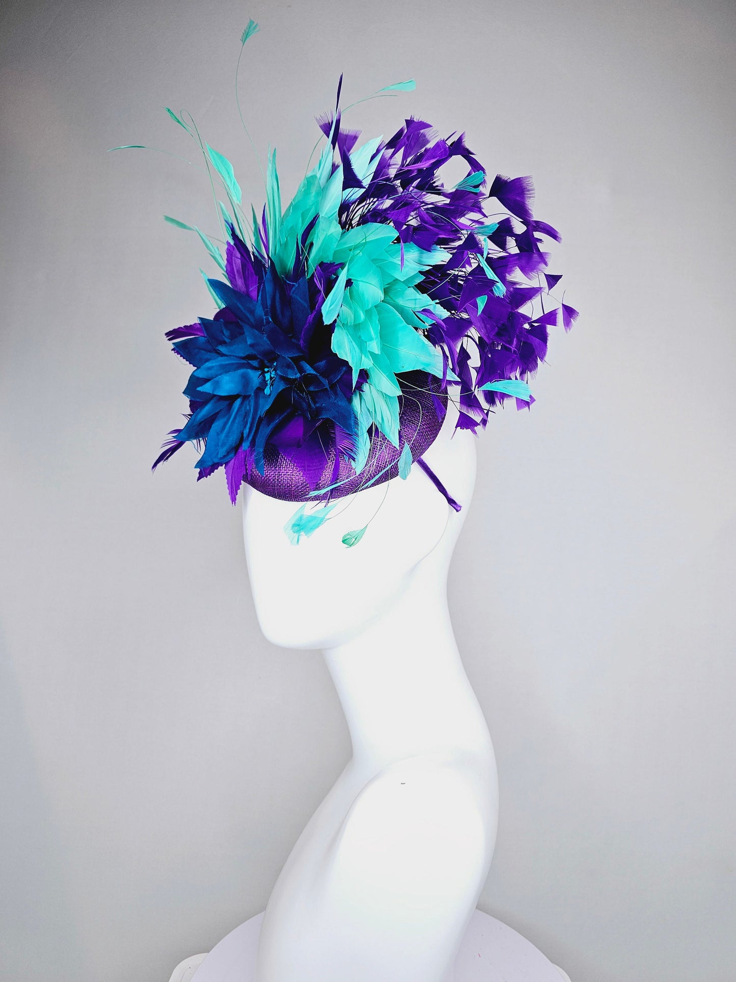 kentucky derby hat fascinator purple sinamay with feather flower and feathers green feathers and silk deep blue flower