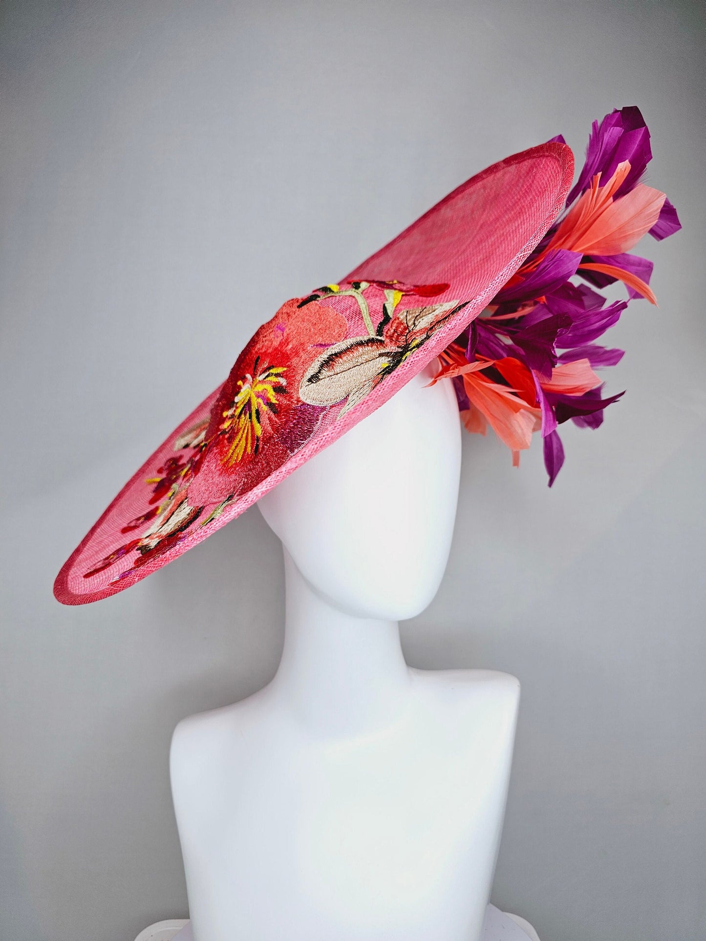 kentucky derby hat fascinator bright pink coral sinamay saucer with lavender purple coral yellow embroidered flowers purple coral feathers