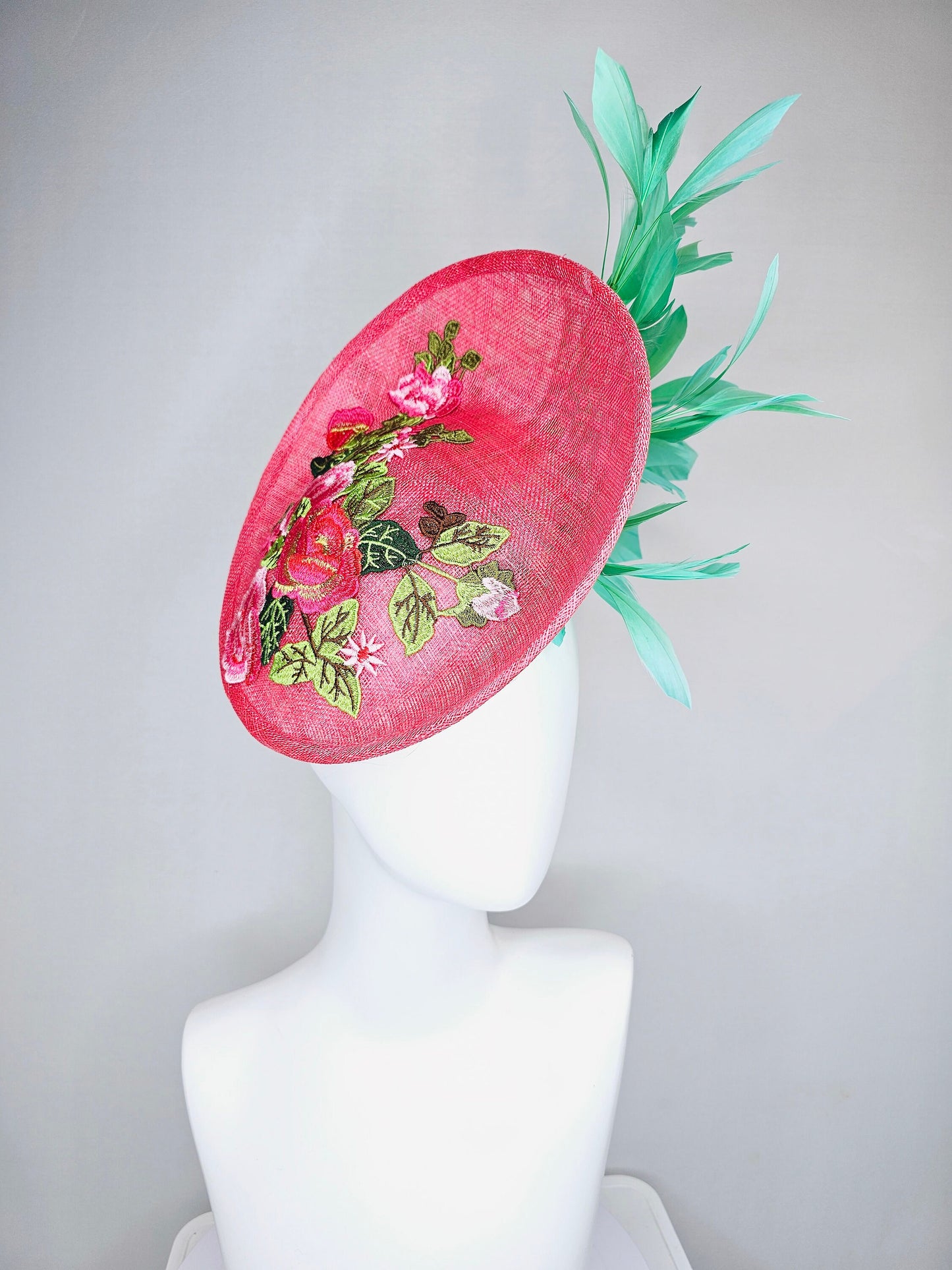 kentucky derby hat peach pink sinamay saucer with peach green gold pink embroidered flowers with green feathers