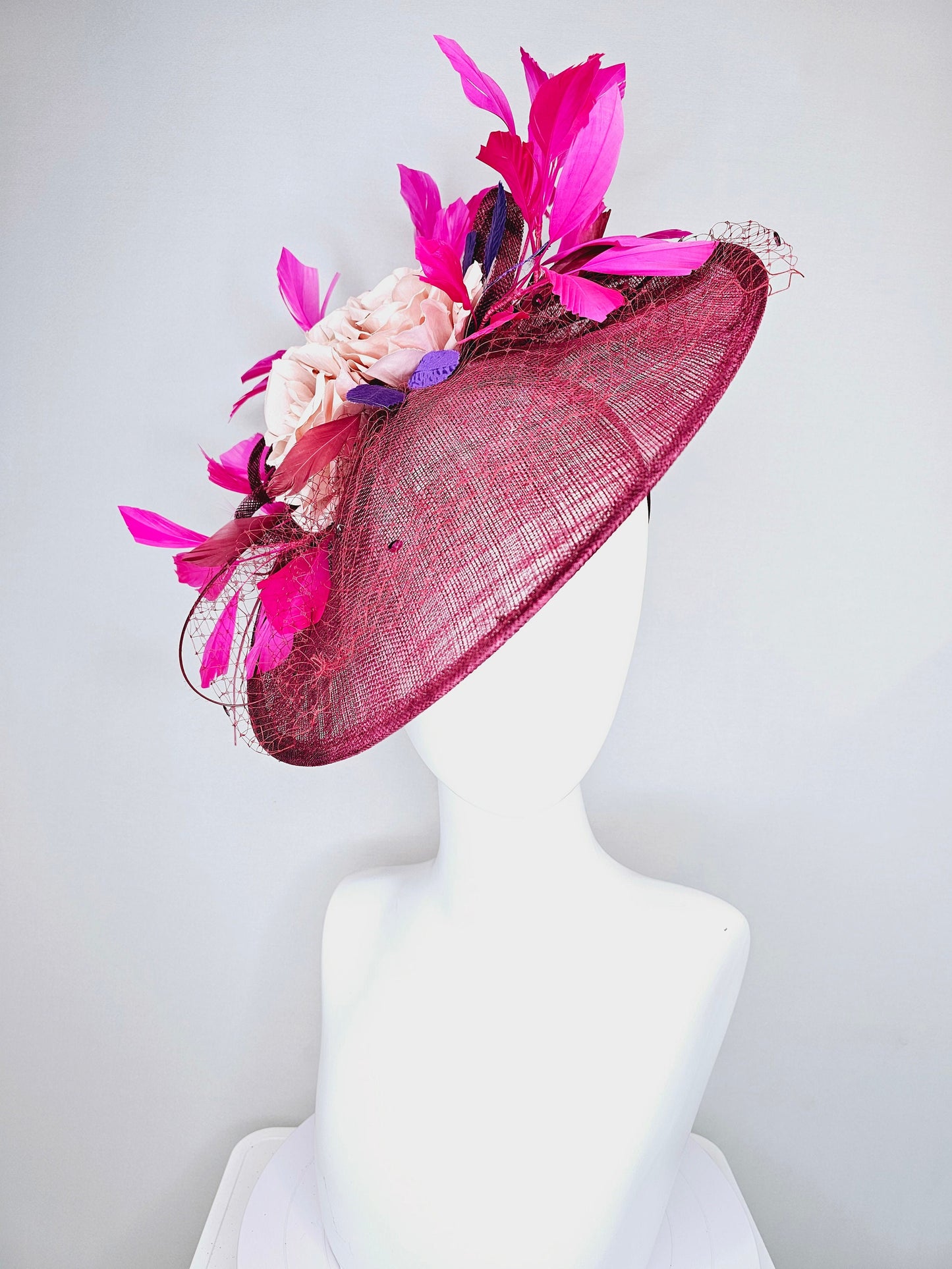 kentucky derby hat fascinator magenta maroon wine saucer with netting mauve pink flowers purple leaves and fuchsia pink feathers