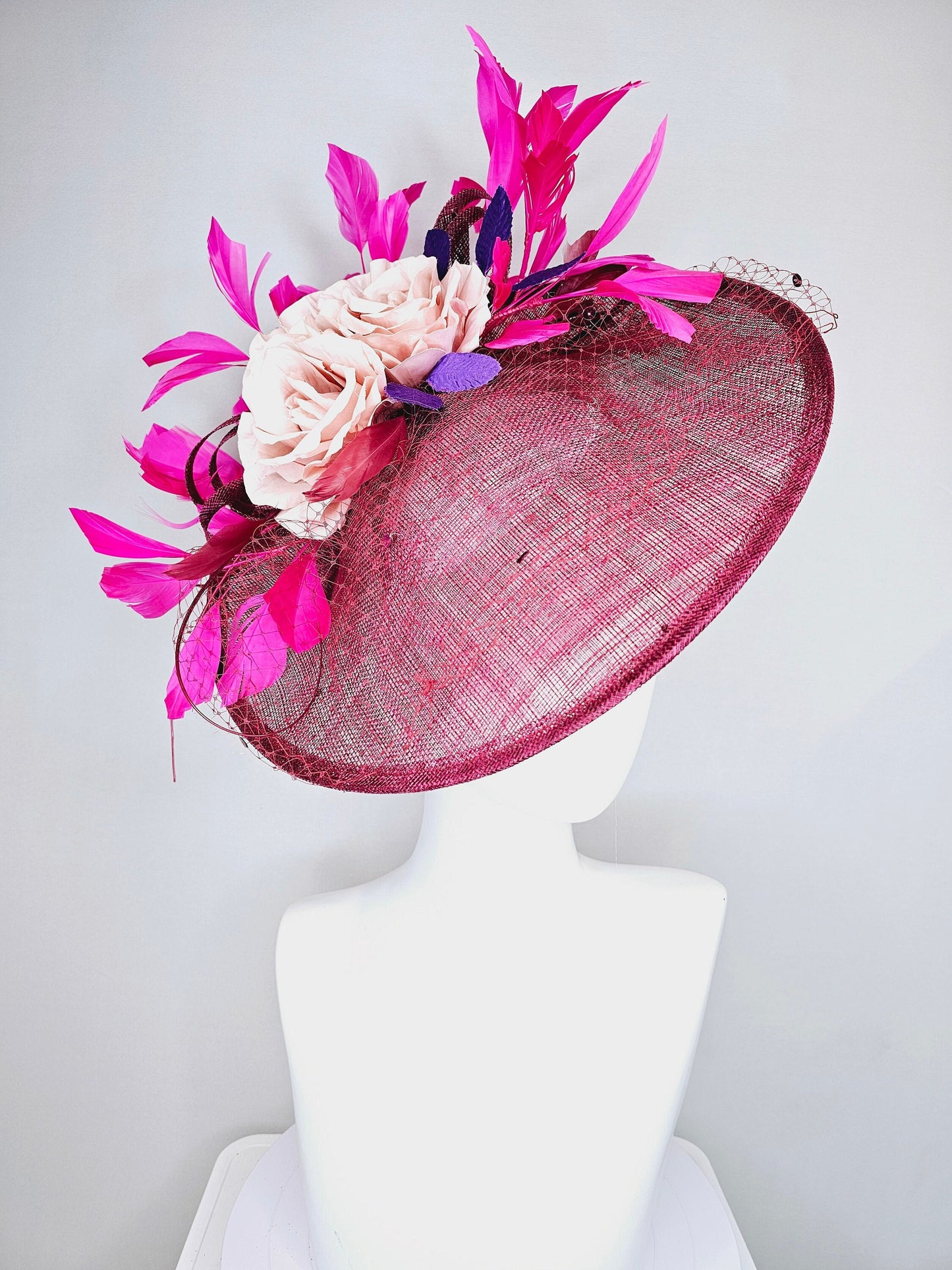 kentucky derby hat fascinator magenta maroon wine saucer with netting mauve pink flowers purple leaves and fuchsia pink feathers