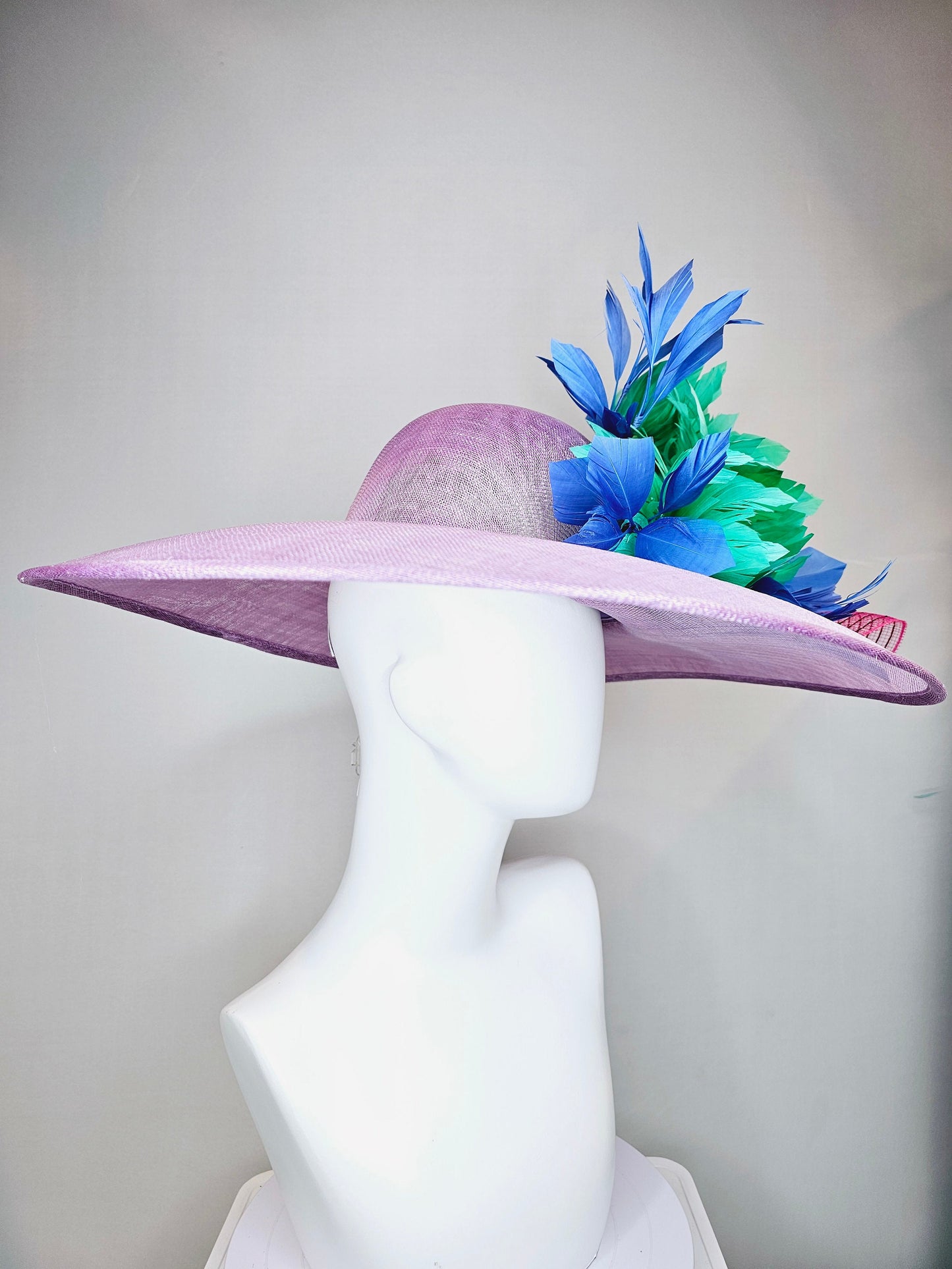 kentucky derby hat large wide brim sinamay purple lavender hat w emerald green feather flowers, blue feathers and bright pink crinoline