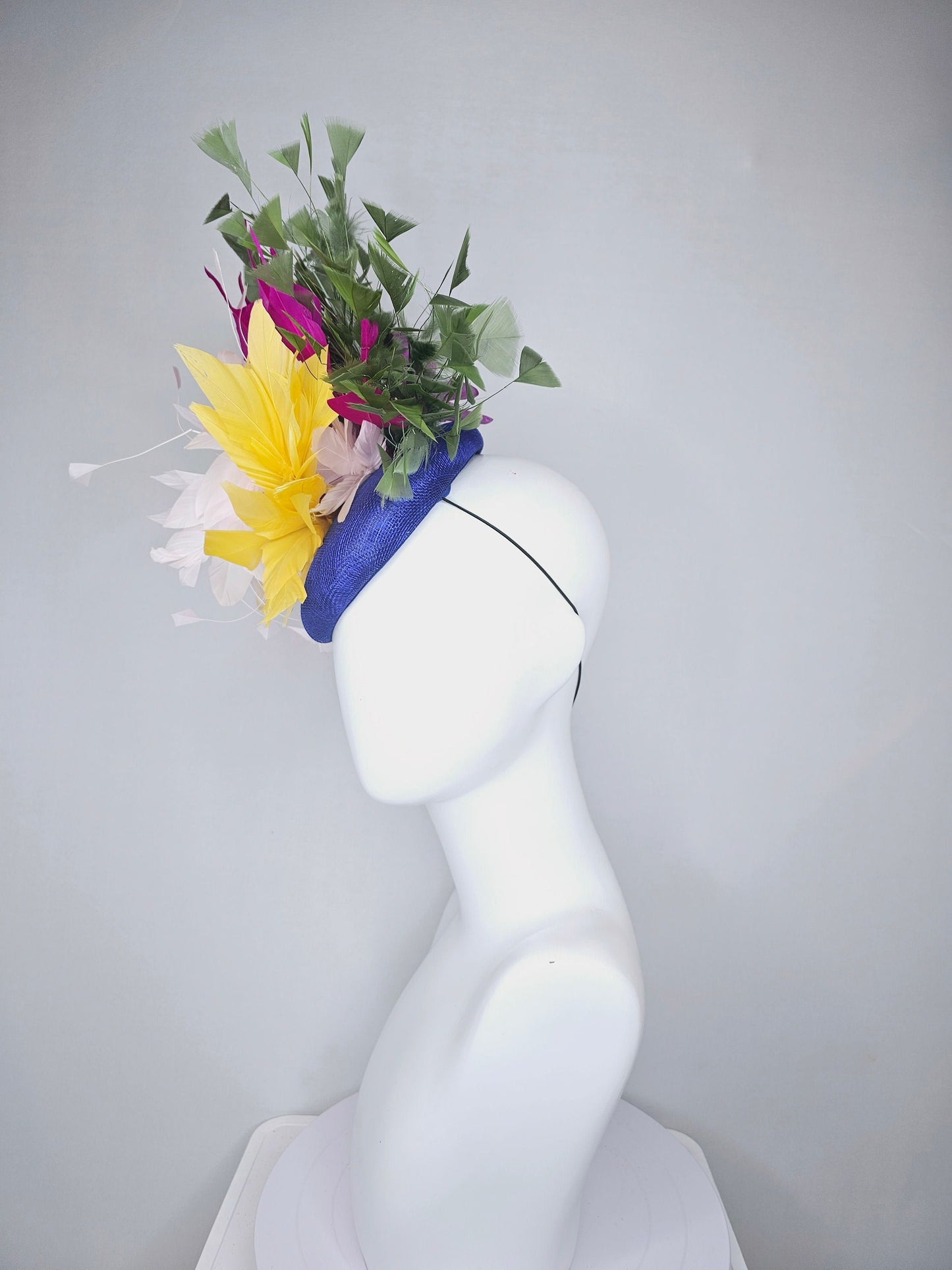 kentucky derby hat fascinator royal blue sinamay with bright yellow, ivory white,fuchsia pink, and hunter green branching feathers
