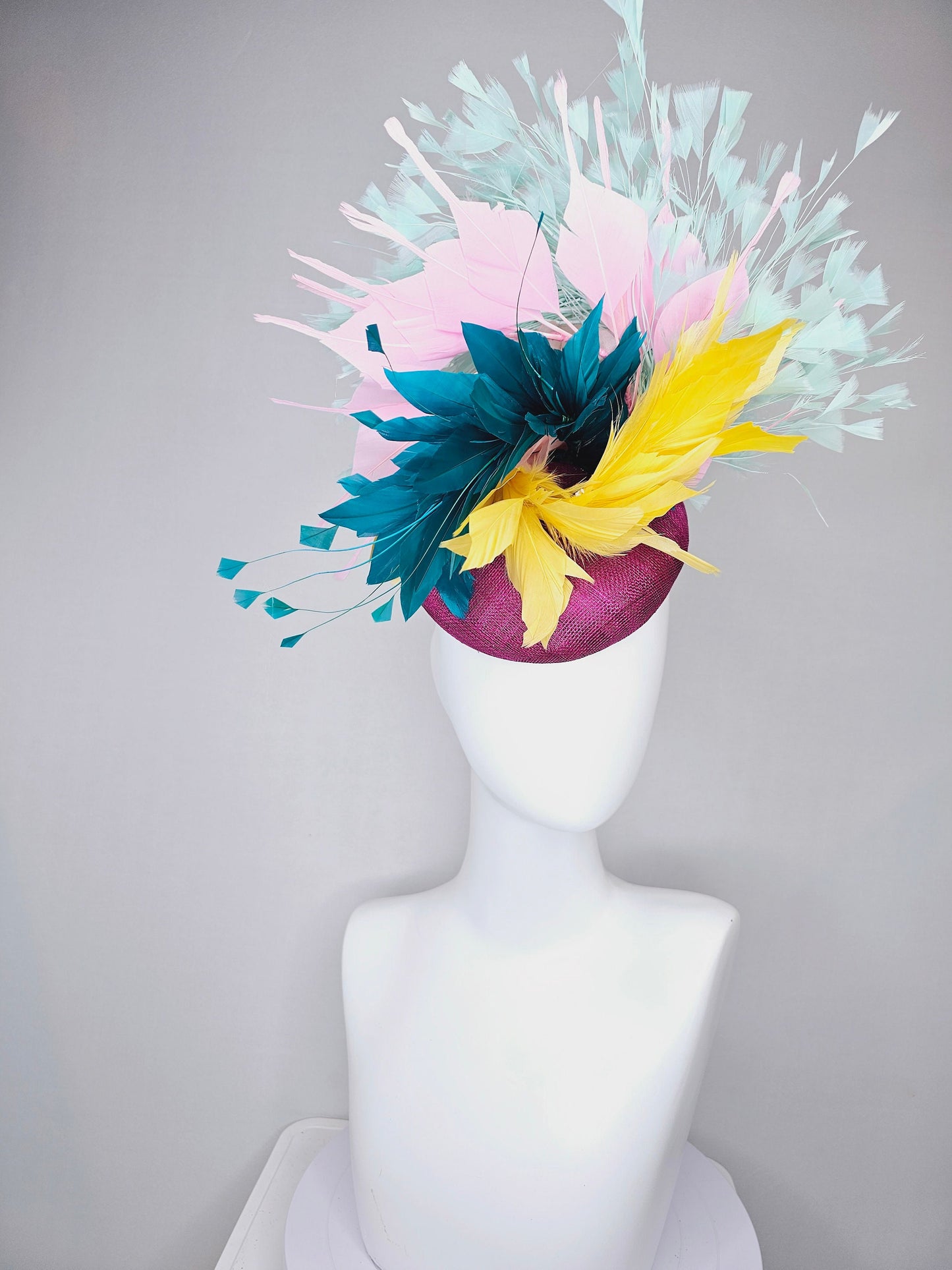 kentucky derby hat fascinator purple violet sinamay with colorful bright yellow, teal blue, baby pink, and baby blue branching feathers