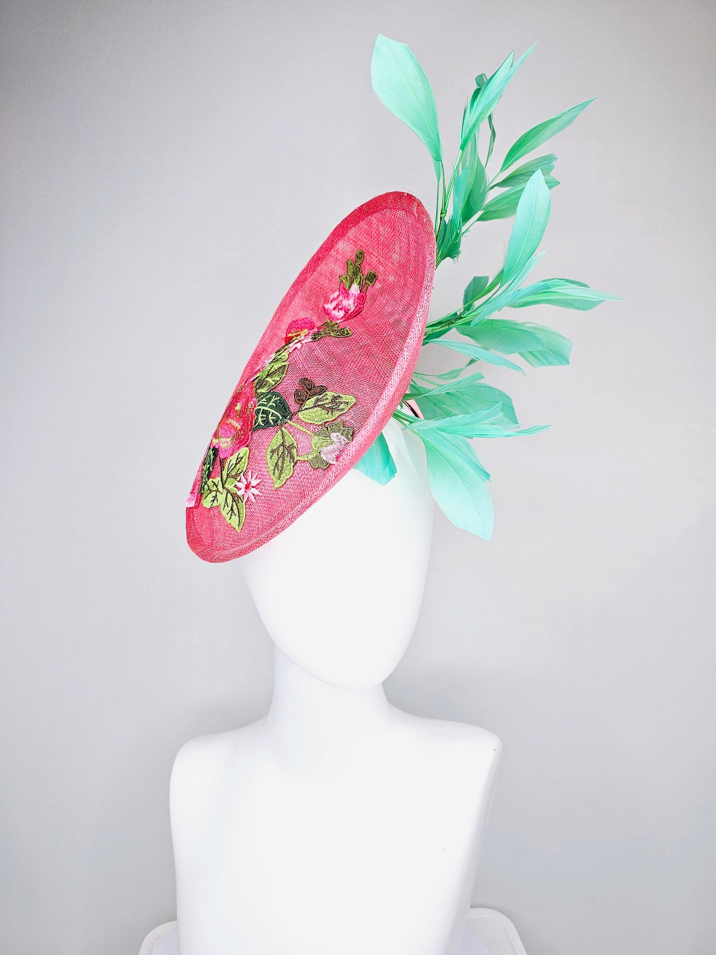 kentucky derby hat peach pink sinamay saucer with peach green gold pink embroidered flowers with green feathers