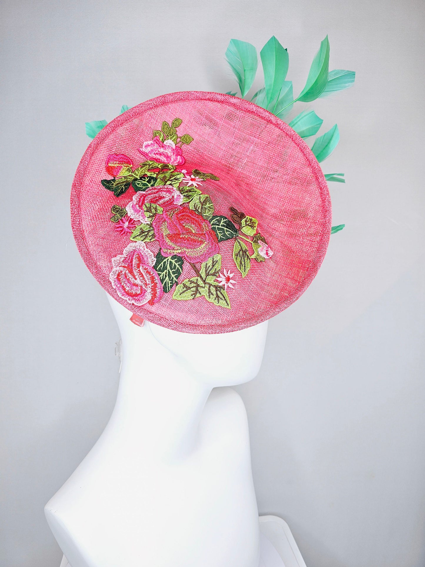 kentucky derby hat peach pink sinamay saucer with peach green gold pink embroidered flowers with green feathers