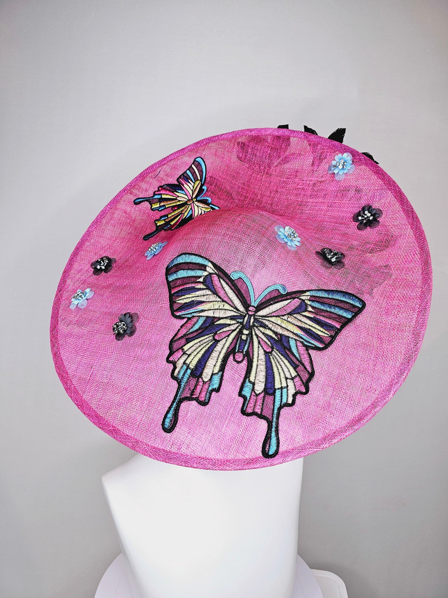 kentucky derby hat fascinator large pink sinamay saucer rainbow embroidered butterflies,blue black sequin beaded flowers,black blue feather