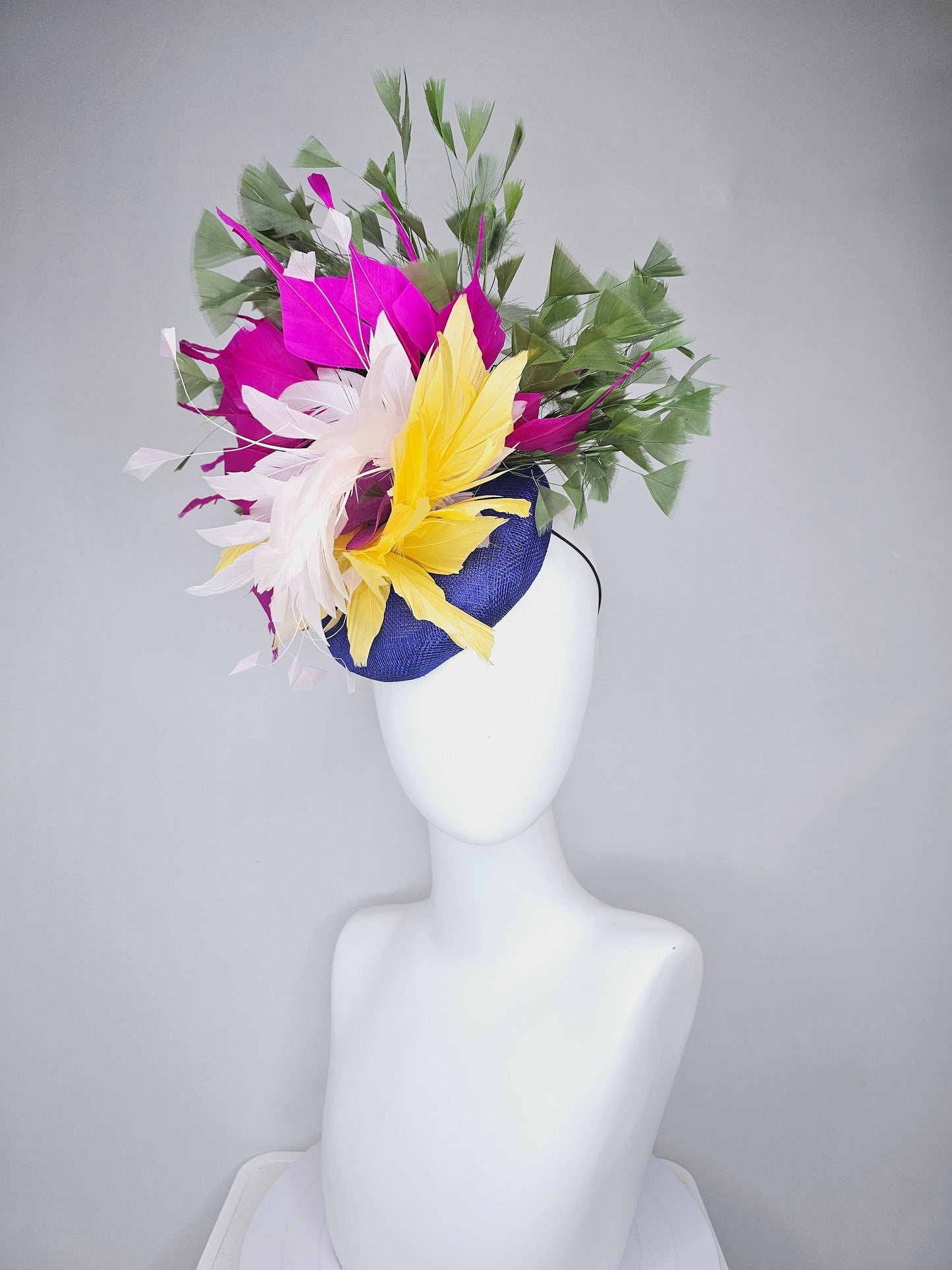 kentucky derby hat fascinator royal blue sinamay with bright yellow, ivory white,fuchsia pink, and hunter green branching feathers