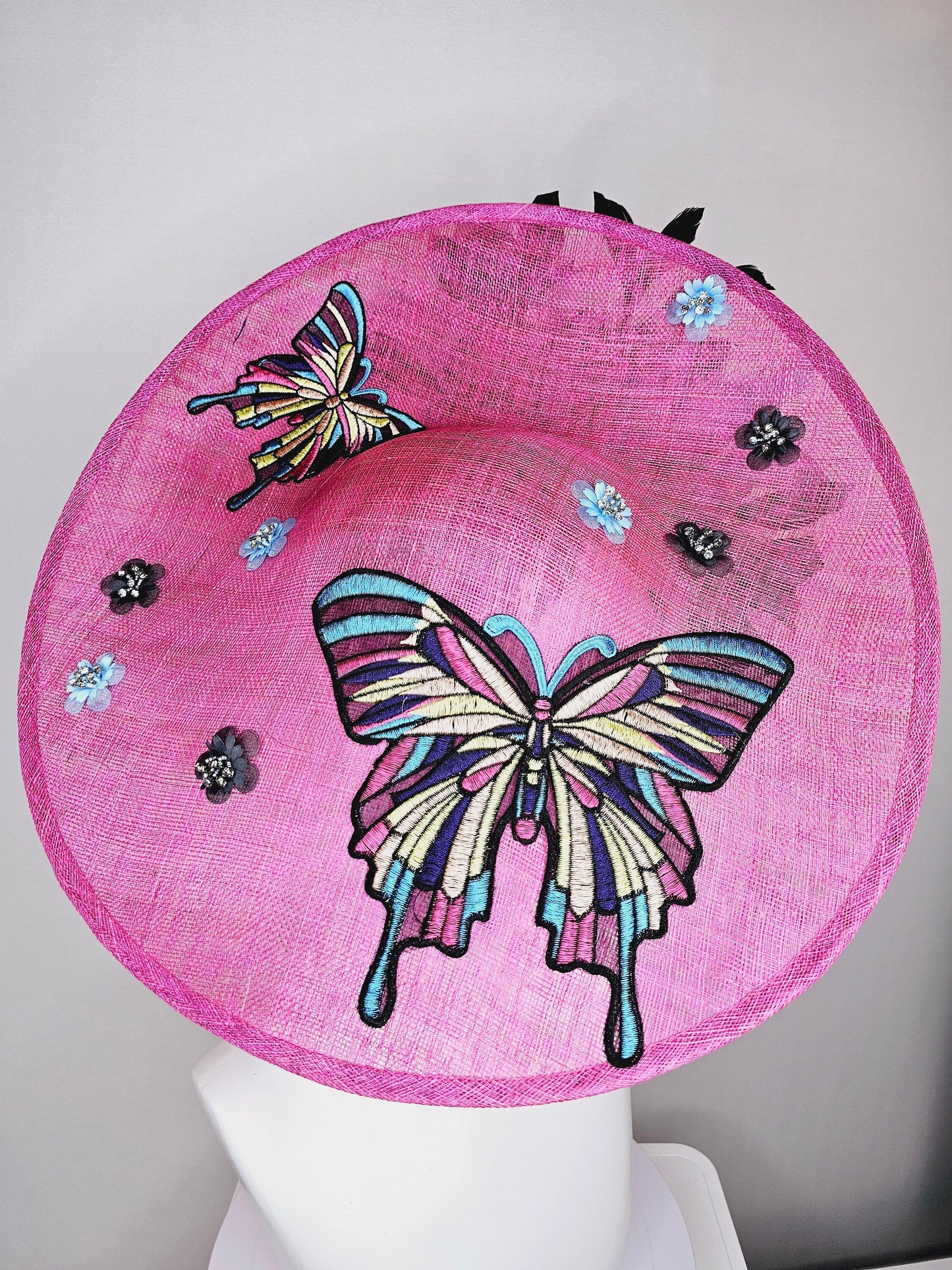 kentucky derby hat fascinator large pink sinamay saucer rainbow embroidered butterflies,blue black sequin beaded flowers,black blue feather