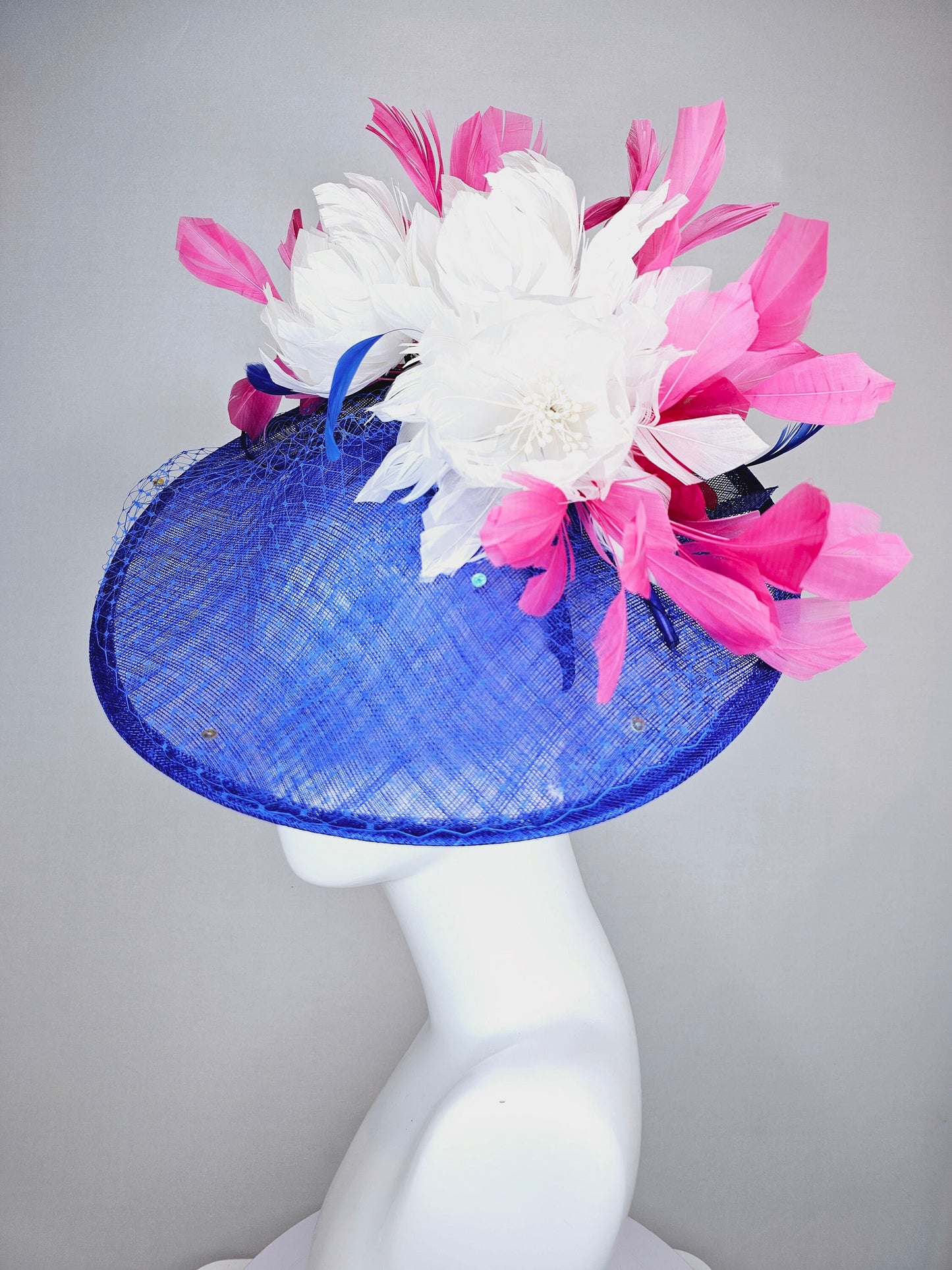 kentucky derby hat fascinator royal blue saucer with netting and sequin white fluffy feather flowers and branching pink feathers