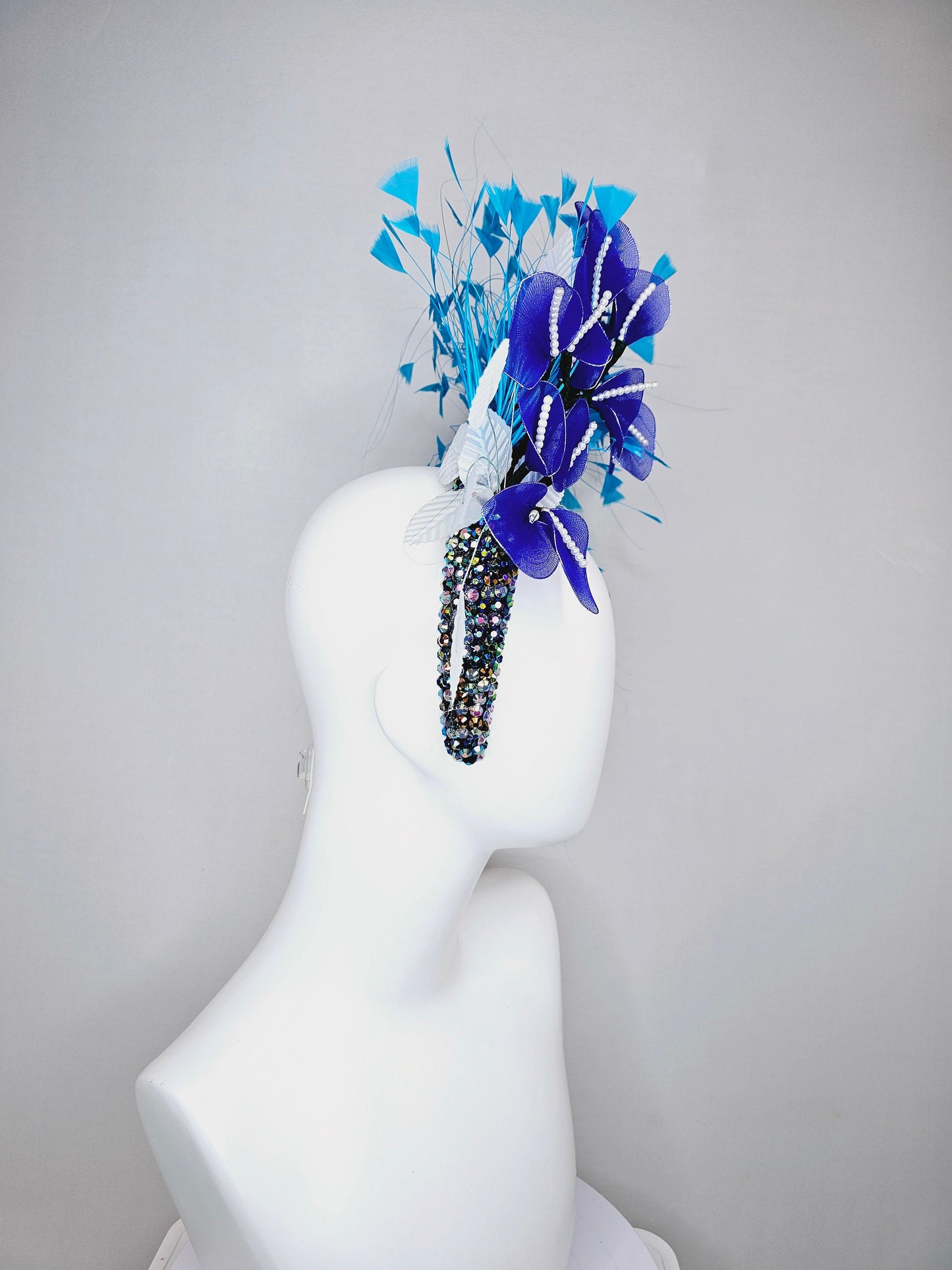 kentucky derby hat fascinator iridescent blue rhinestone crystal headband with blue wire flowers ocean blue feathers white velvet leaves