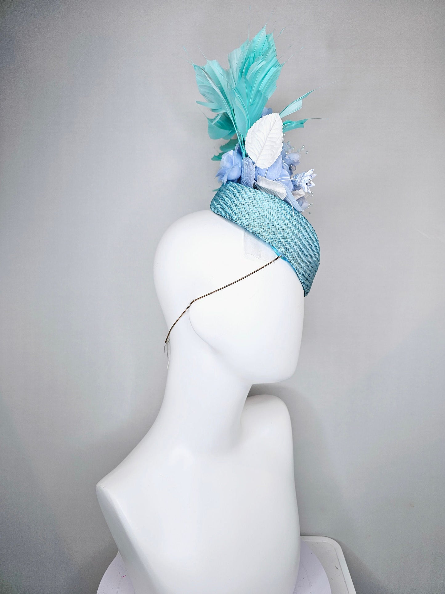 kentucky derby hat fascinator pointed light blue buntal with light blue flowers roses pearls blue leaves and blue aqua large feathers