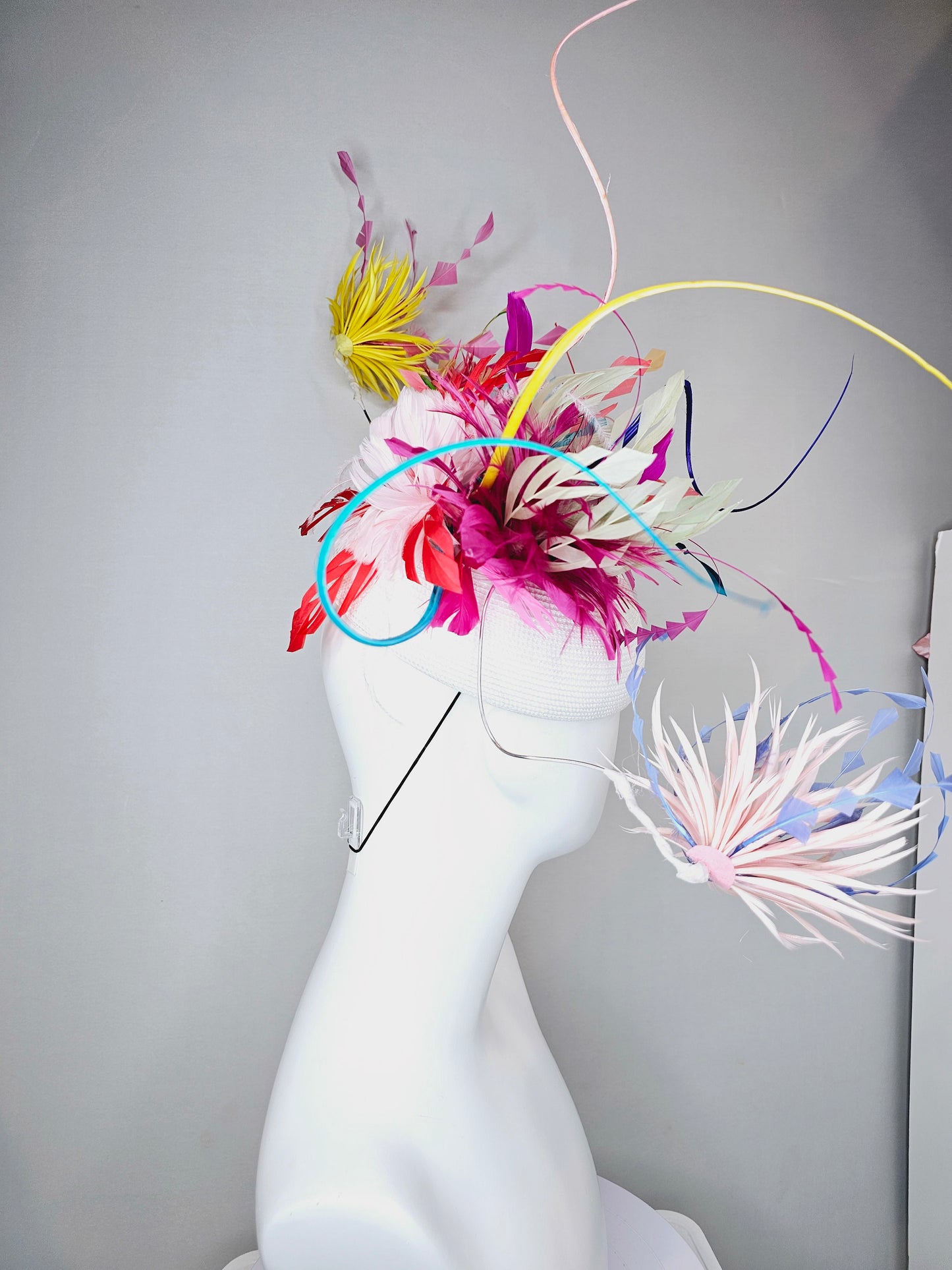 kentucky derby hat fascinator rainbow huge blue red yellow green pink orange avant garde feather headpiece on white base