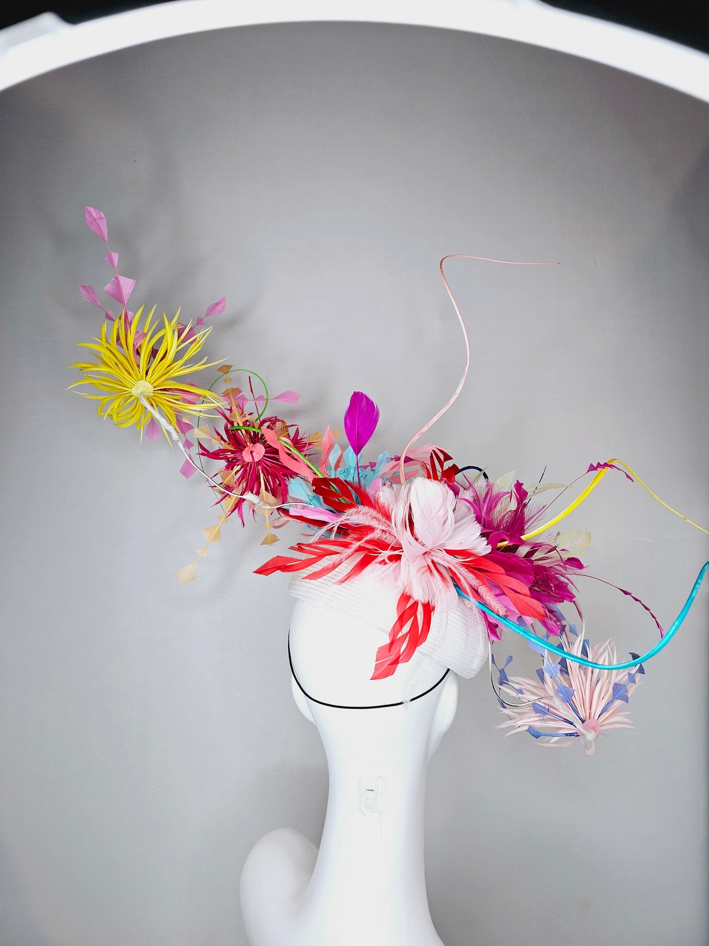 kentucky derby hat fascinator rainbow huge blue red yellow green pink orange avant garde feather headpiece on white base