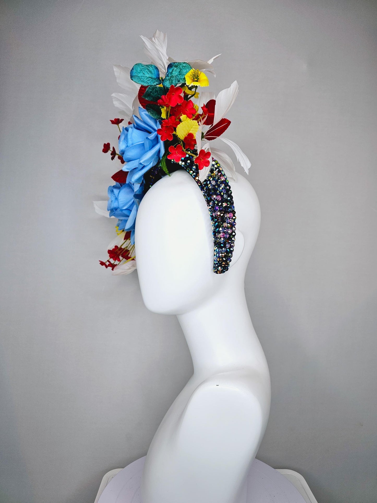 kentucky derby hat fascinator iridescent blue crystal rhinestone headband,blue roses, red and yellow flowers, yellow leaves white feathers