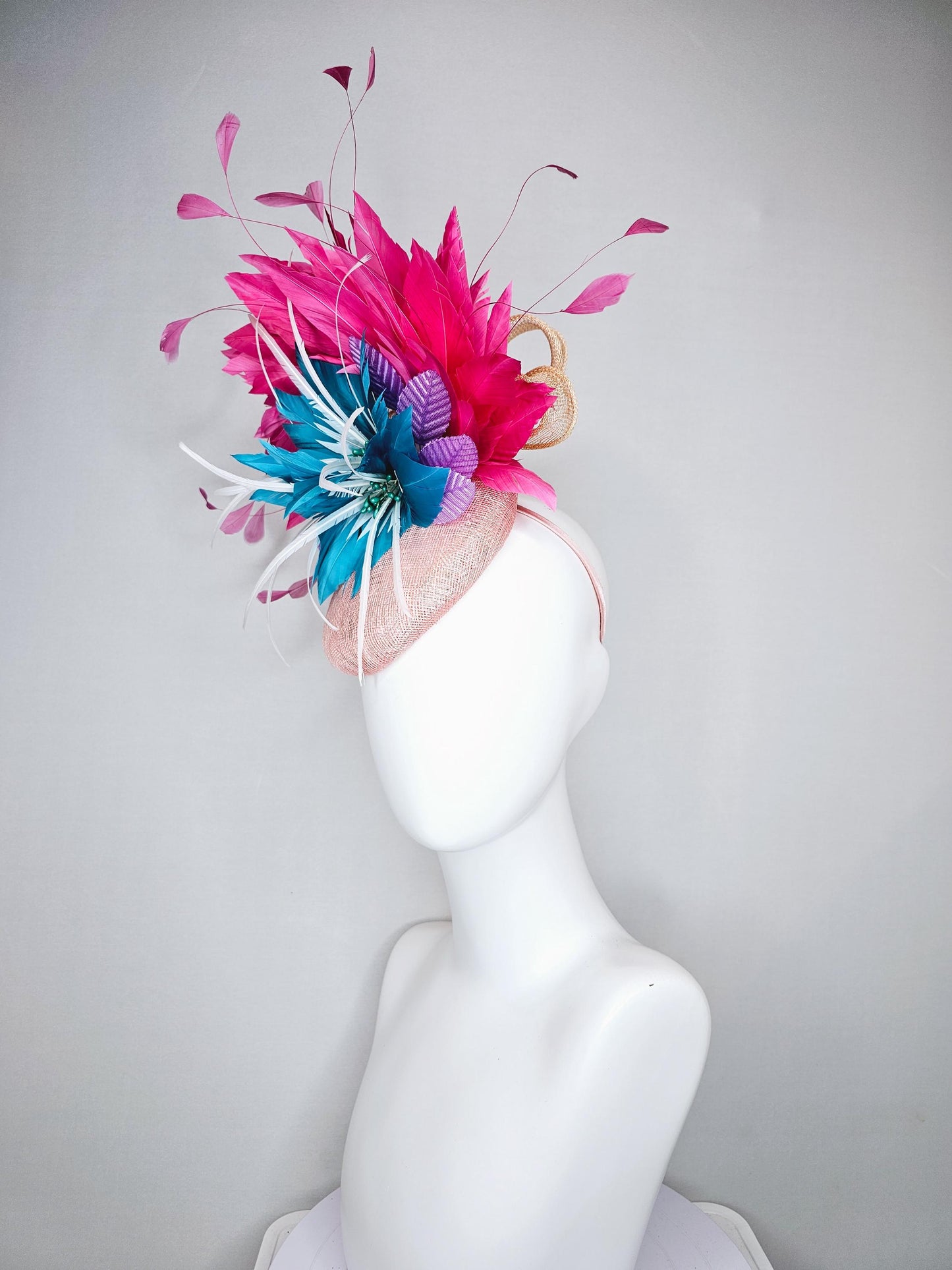 kentucky derby hat fascinator light pink sinamay with royal blue feather flower with fuchsia hot pink feathers and purple velvet leaves