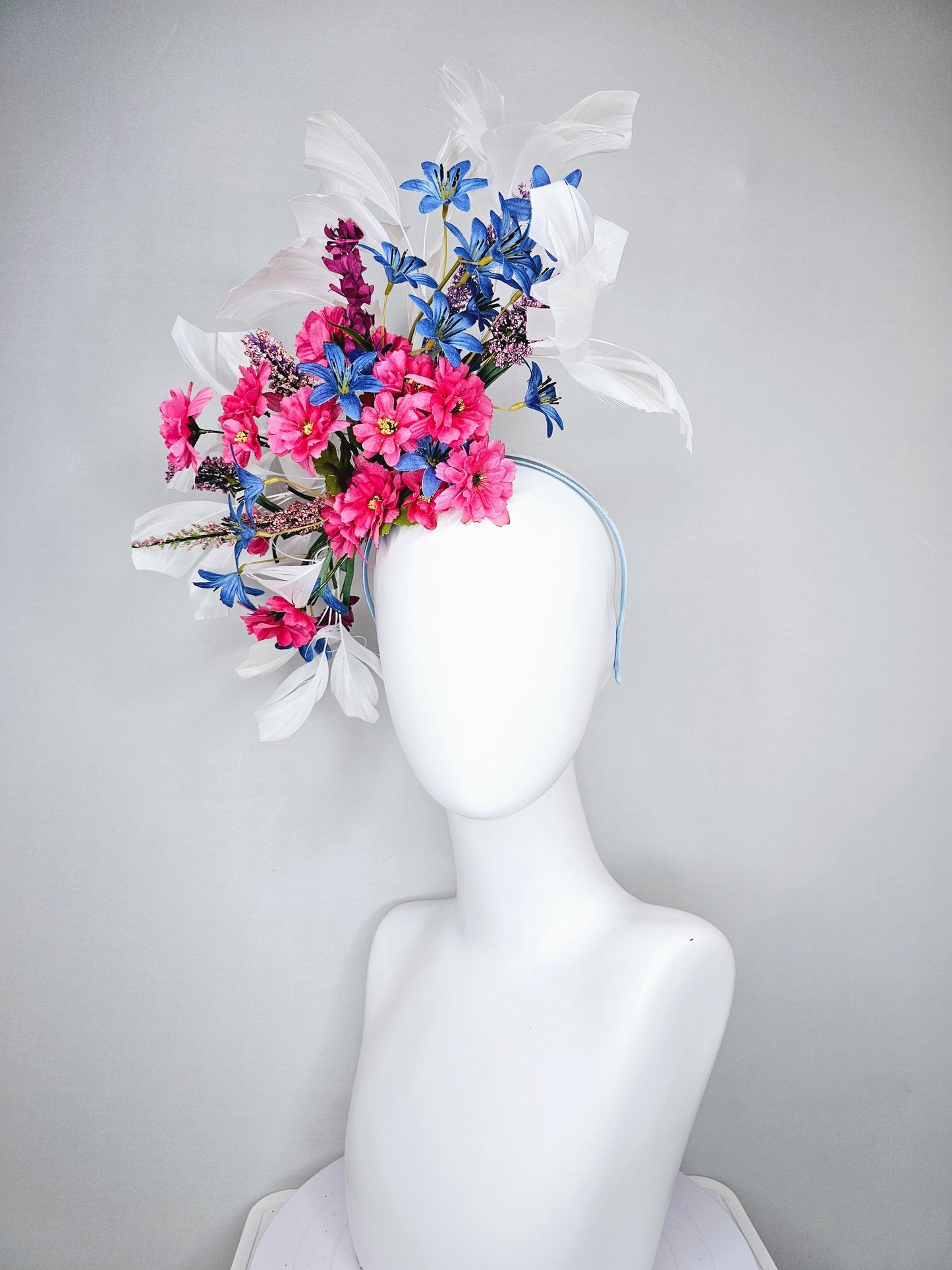 kentucky derby hat fascinator headband with pink and blue satin flowers and branching lavender purple stems with white feathers