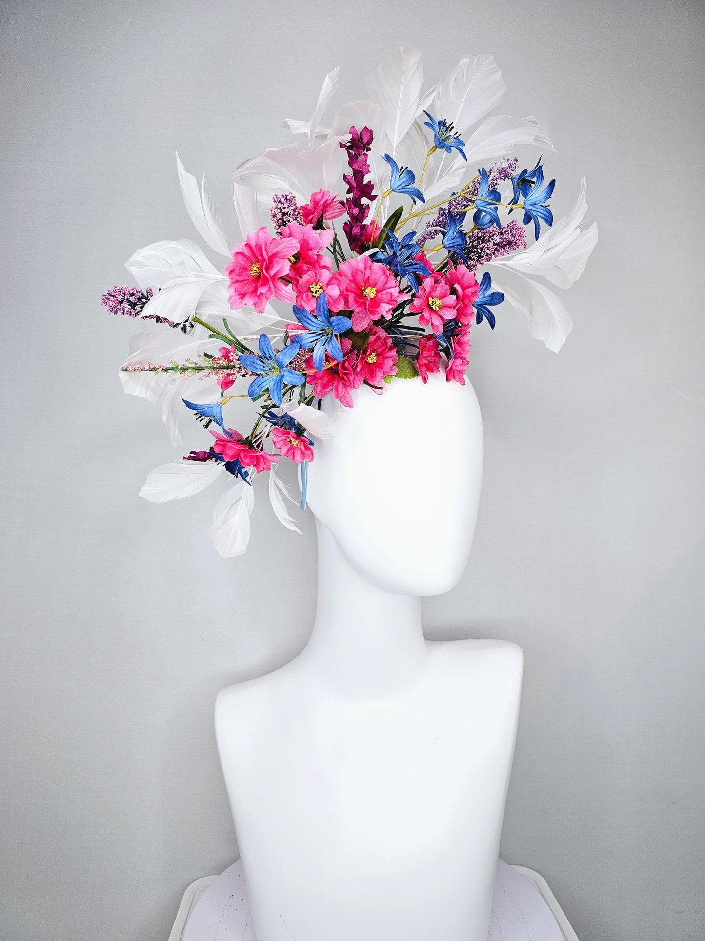 kentucky derby hat fascinator headband with pink and blue satin flowers and branching lavender purple stems with white feathers