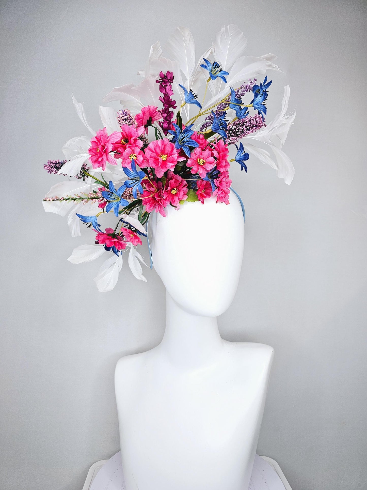 kentucky derby hat fascinator headband with pink and blue satin flowers and branching lavender purple stems with white feathers
