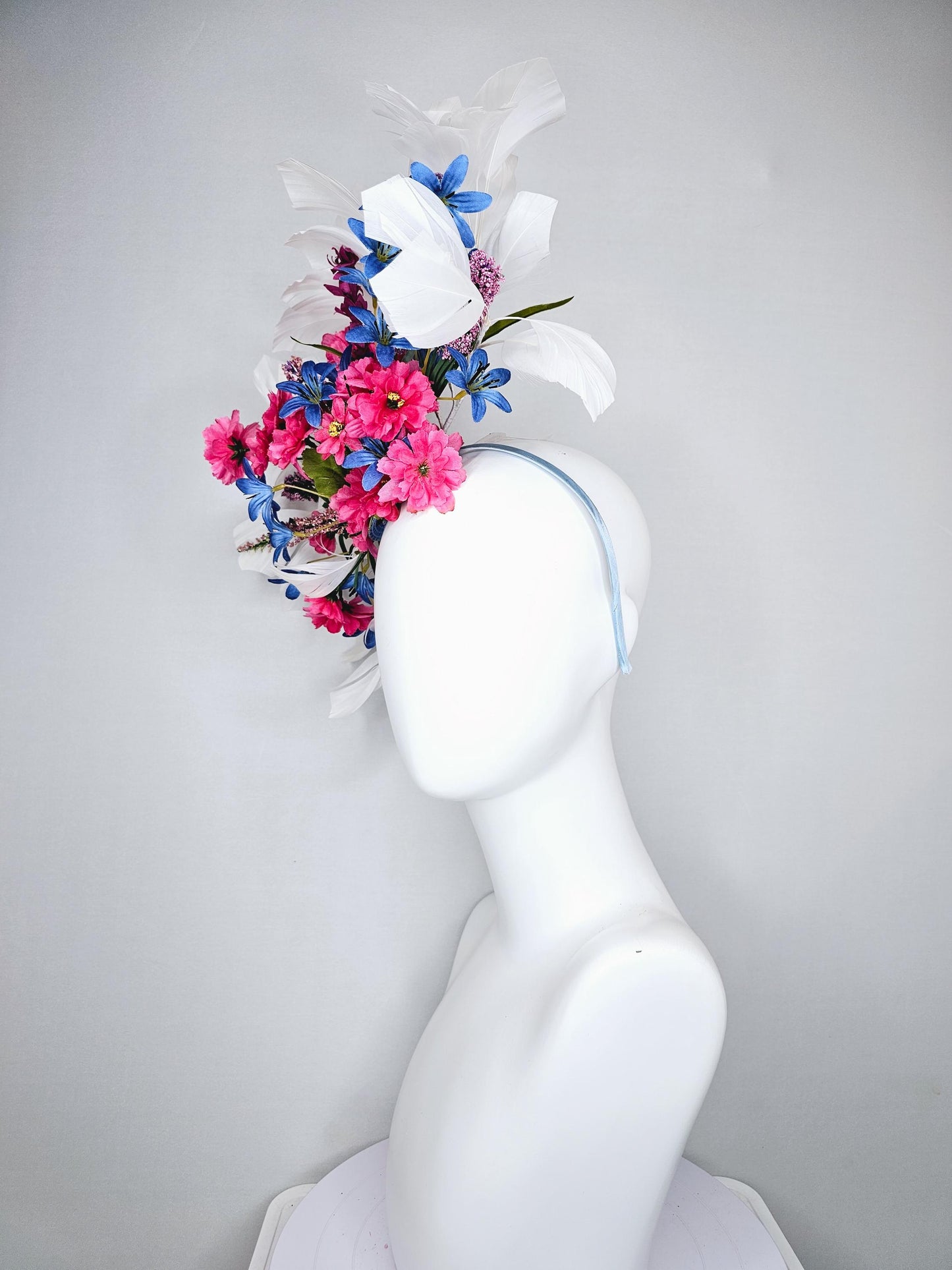 kentucky derby hat fascinator headband with pink and blue satin flowers and branching lavender purple stems with white feathers