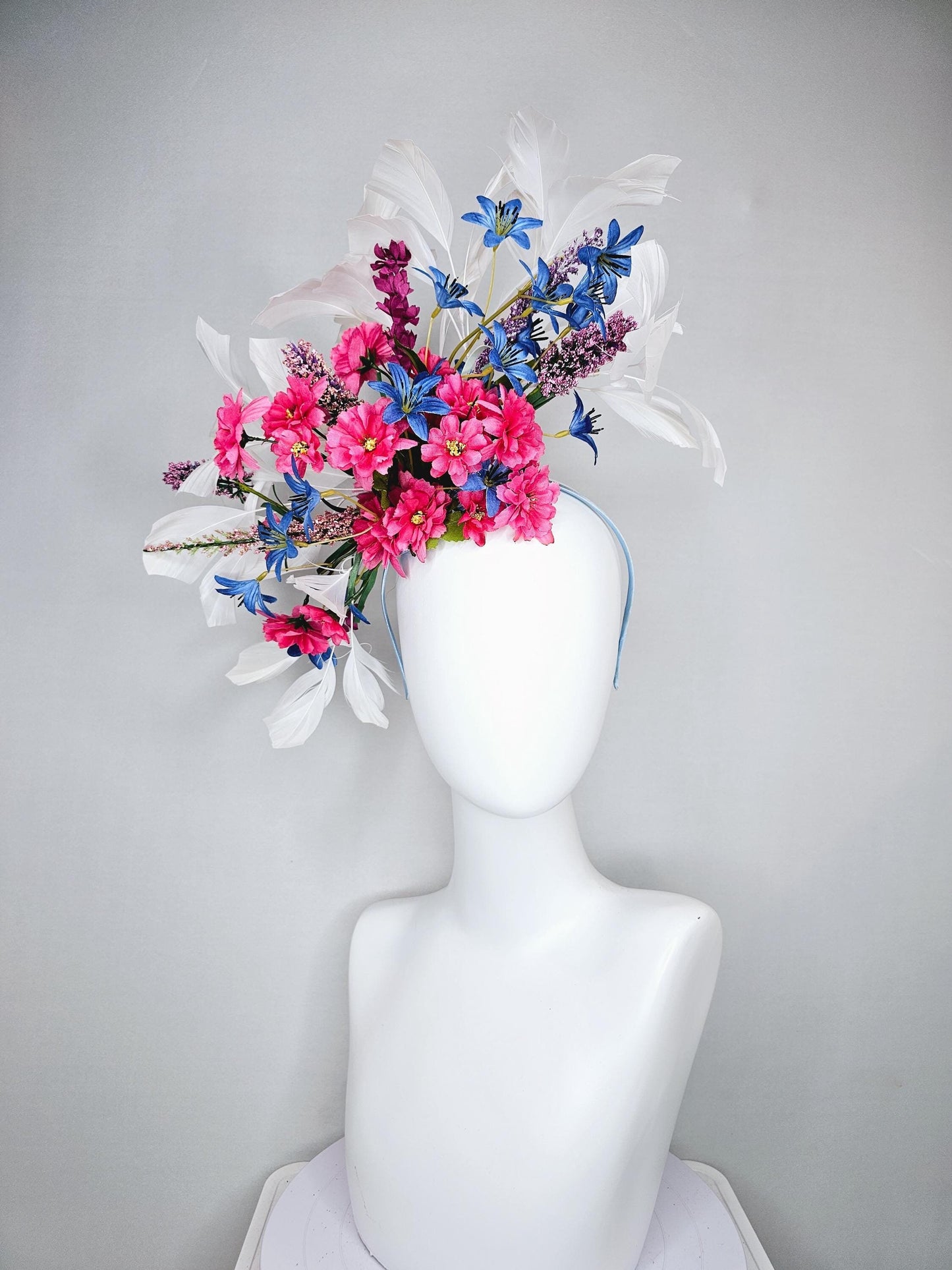 kentucky derby hat fascinator headband with pink and blue satin flowers and branching lavender purple stems with white feathers