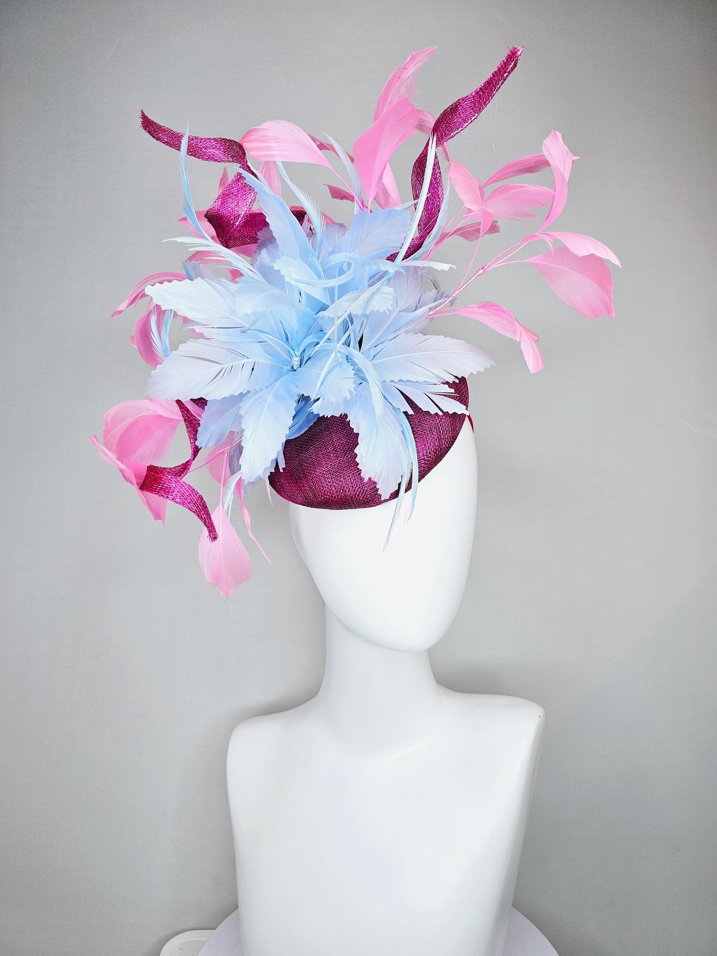 kentucky derby hat fascinator dark fuchsia purple sinamay with large light blue feather flower and light pink feathers with sinamay curls