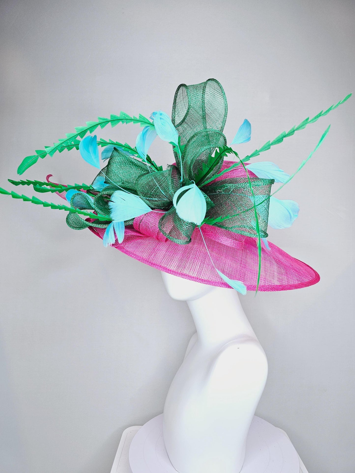 kentucky derby hat large wide brim sinamay hot pink hat with emerald green sinamay bow, green and sky light blue branching feathers