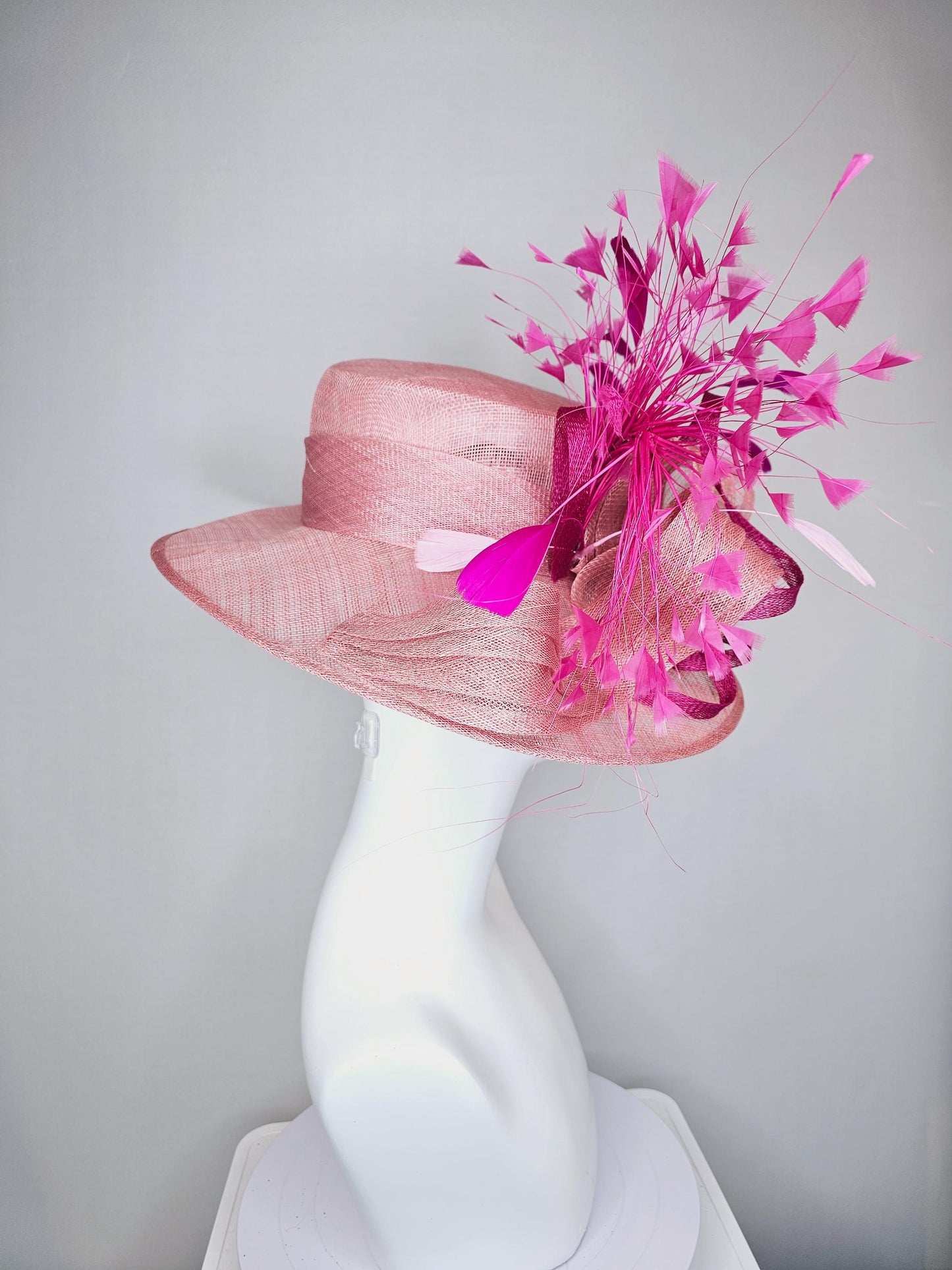 kentucky derby hat large wide brim sinamay light blush pink hat with fuchsia hot pink purple branching feathers and sinamay curls