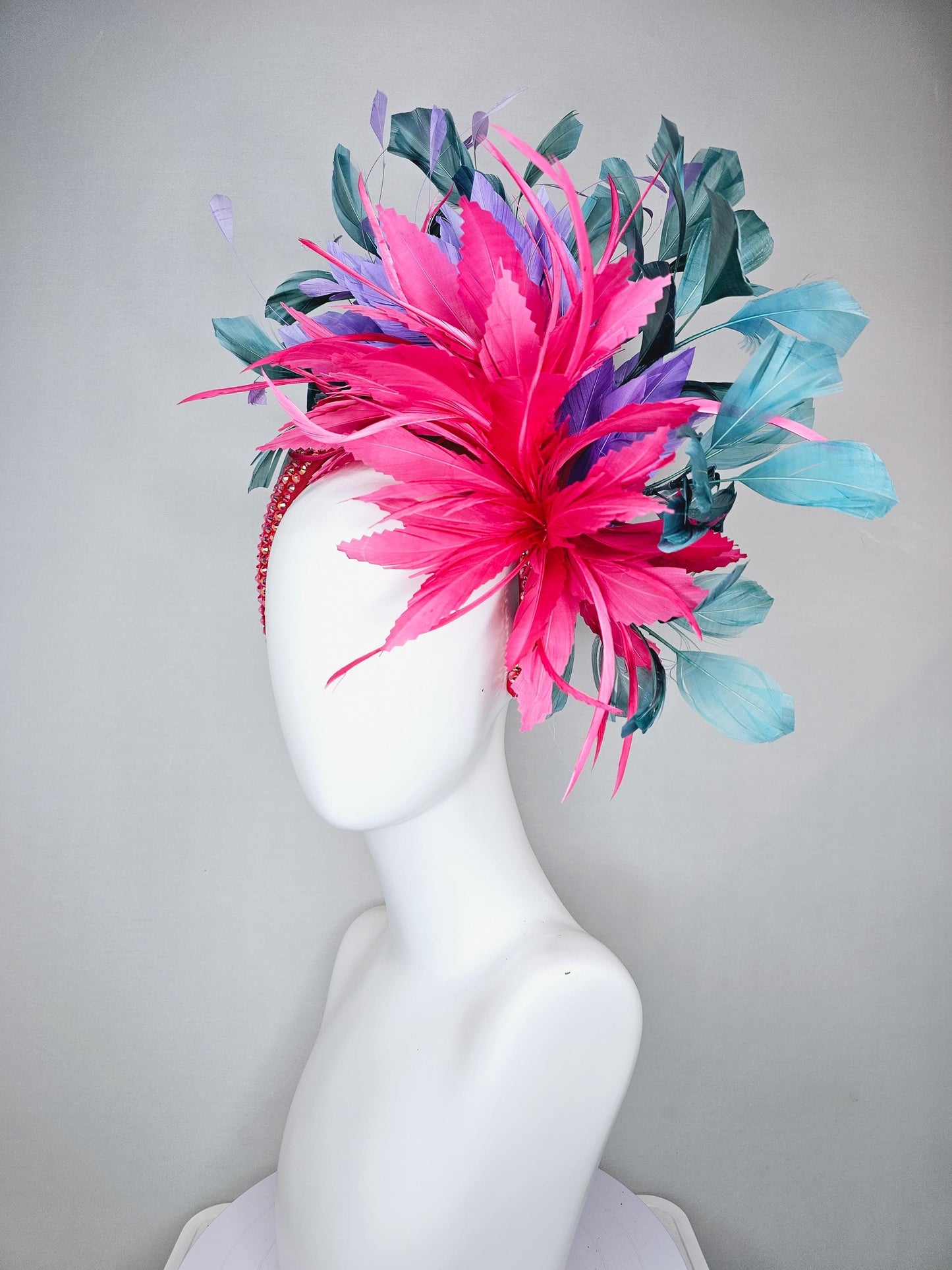 kentucky derby hat fascinator branching hot pink,blue teal,and purple feathers on iridescent Swarovski crystal coral pink headband
