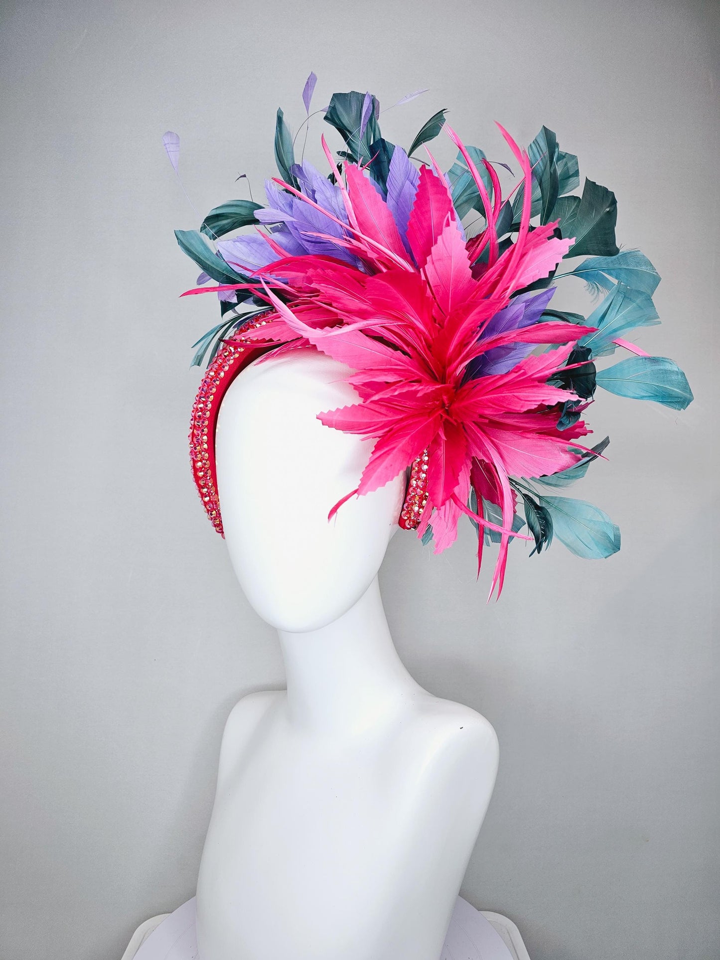 kentucky derby hat fascinator branching hot pink,blue teal,and purple feathers on iridescent Swarovski crystal coral pink headband