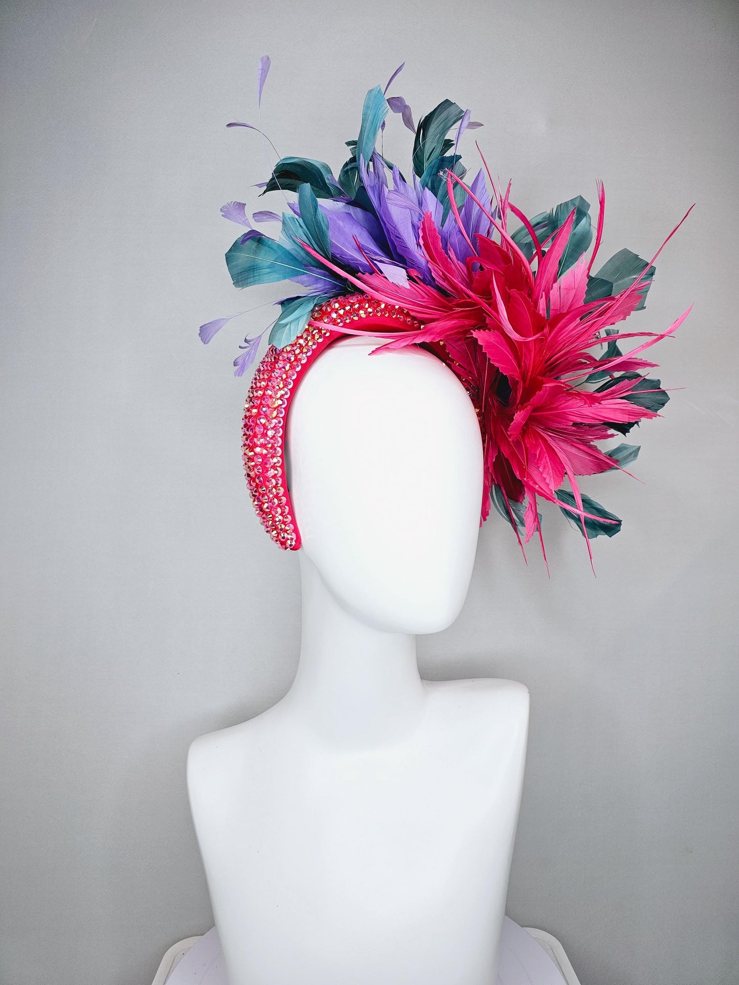 kentucky derby hat fascinator branching hot pink,blue teal,and purple feathers on iridescent Swarovski crystal coral pink headband