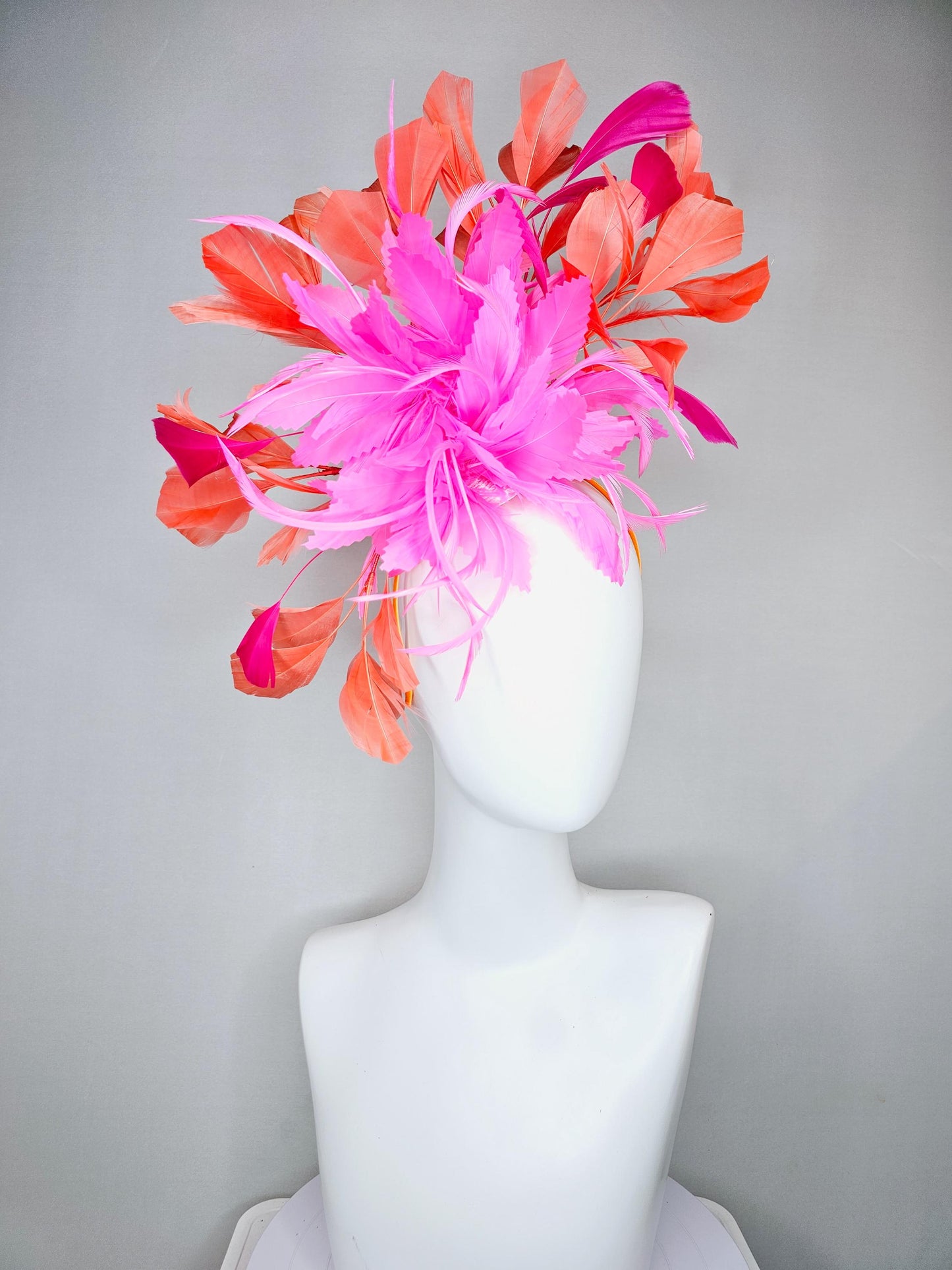 kentucky derby hat fascinator with bright pink feather flowers, fuchsia pink and orange coral branching feathers