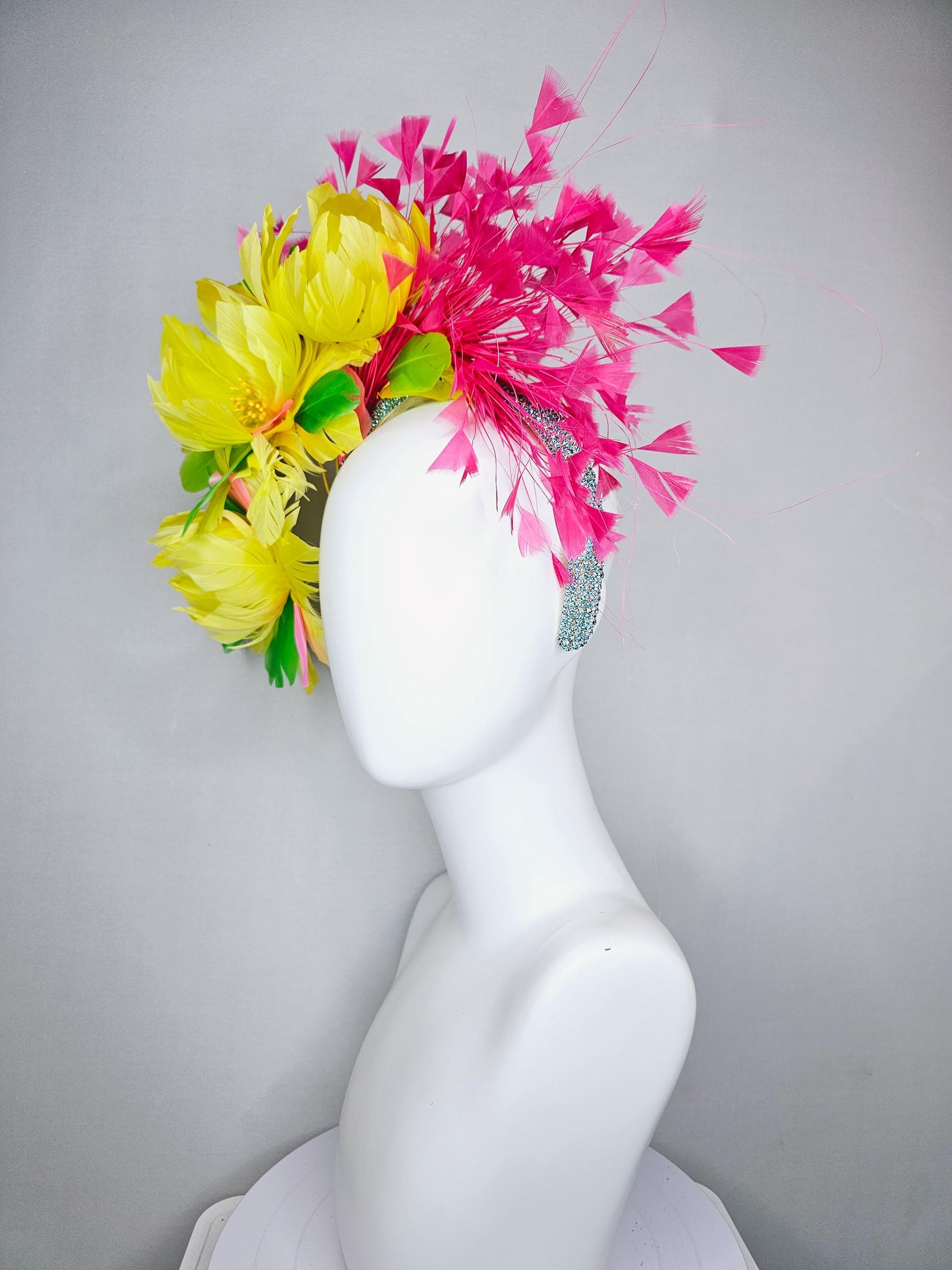 kentucky derby hat fascinator yellow feather flowers,green feather leaves,fuchsia pink branching feathers,sky blue rhinestone headband