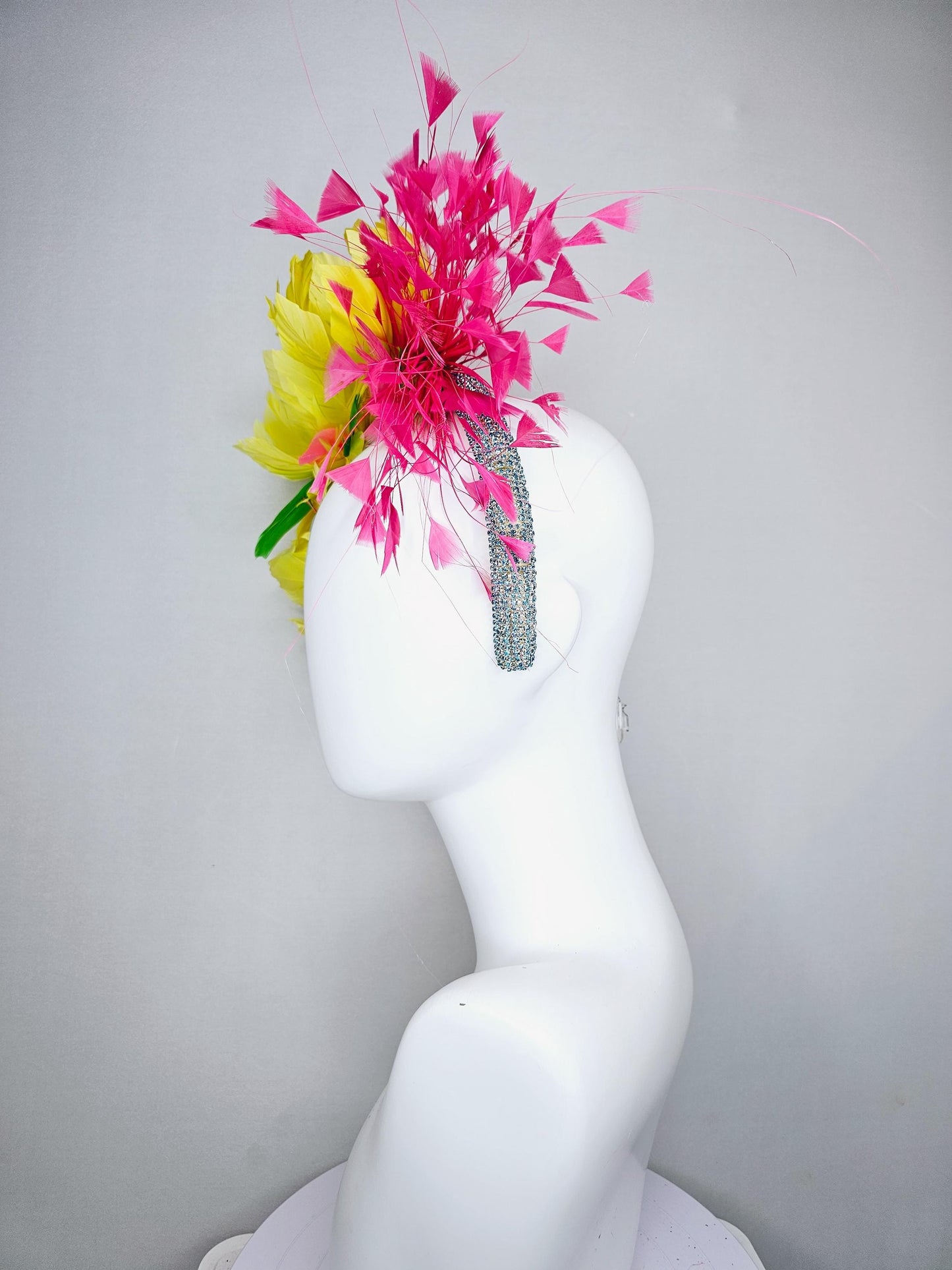 kentucky derby hat fascinator yellow feather flowers,green feather leaves,fuchsia pink branching feathers,sky blue rhinestone headband