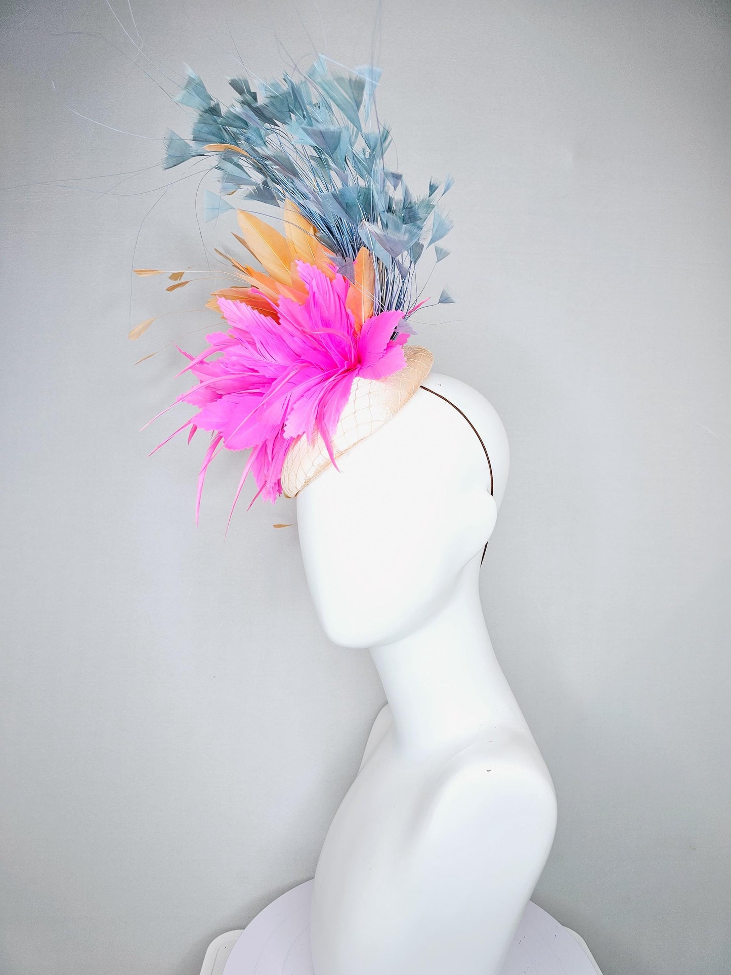 kentucky derby hat fascinator champagne light pink satin with netting with bright pink orange and teal blue branching feathers