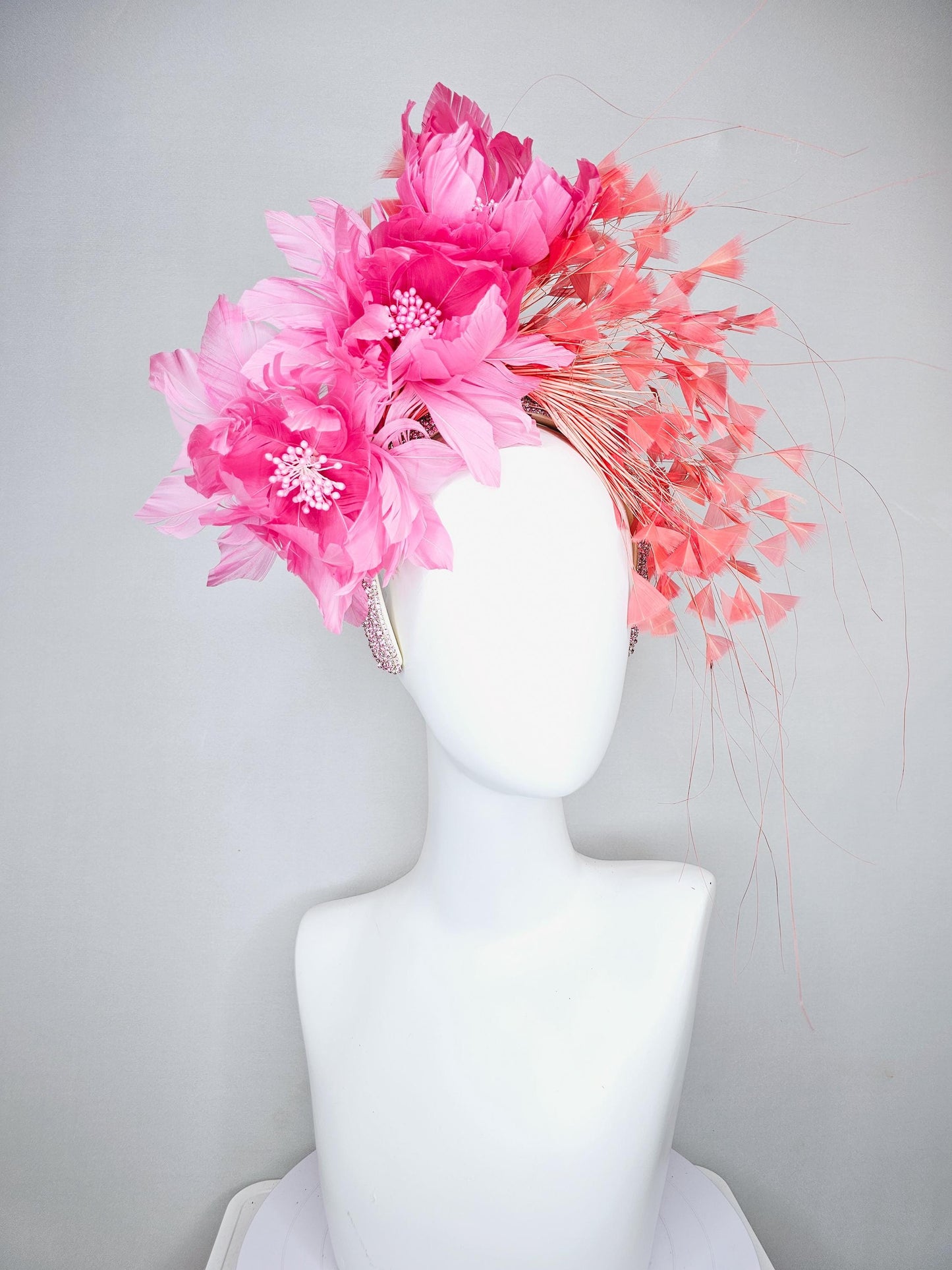 kentucky derby hat fascinator with rose pink feather flowers, light orange coral branching feathers, light pink crystal rhinestone headband