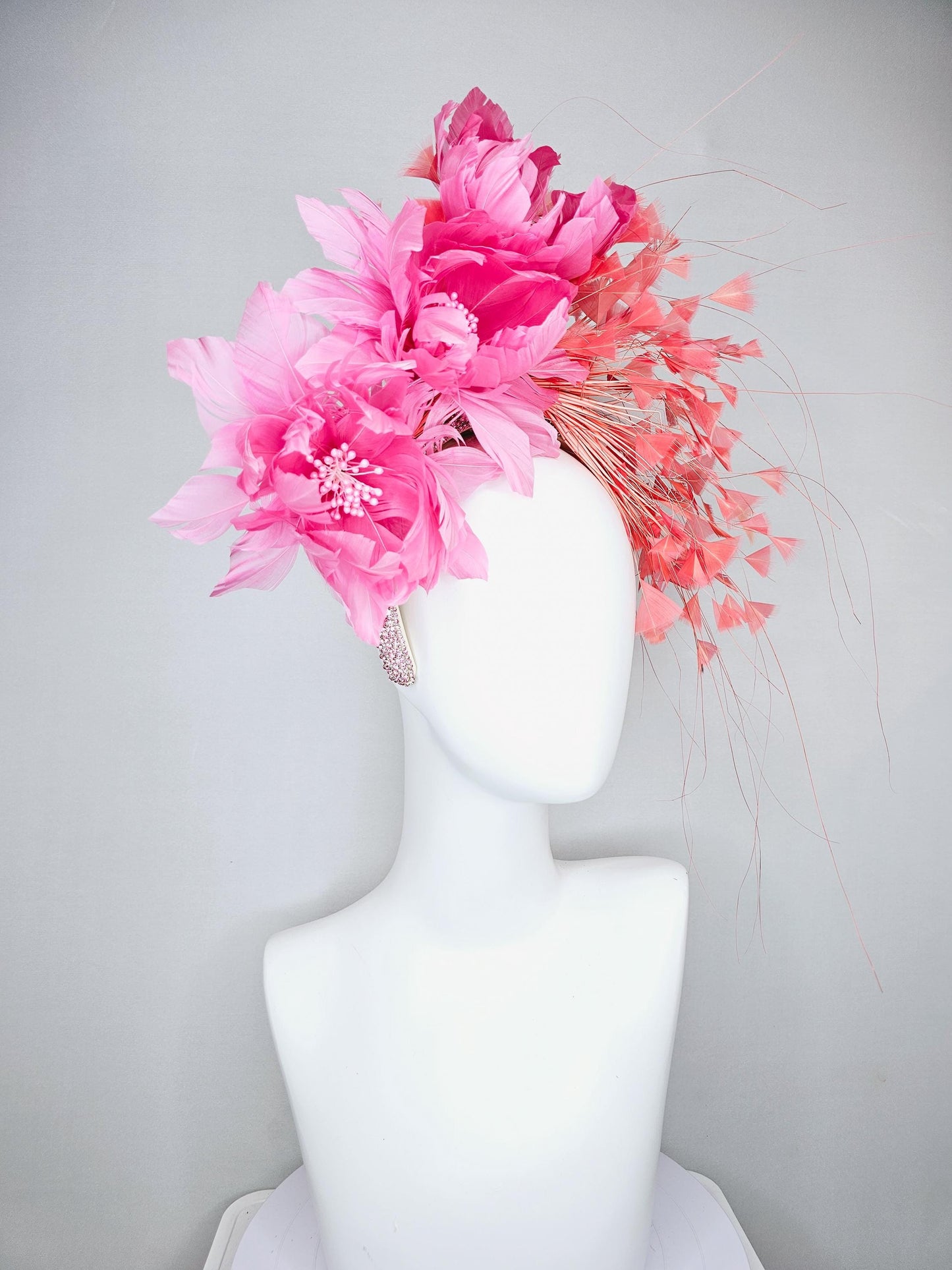 kentucky derby hat fascinator with rose pink feather flowers, light orange coral branching feathers, light pink crystal rhinestone headband